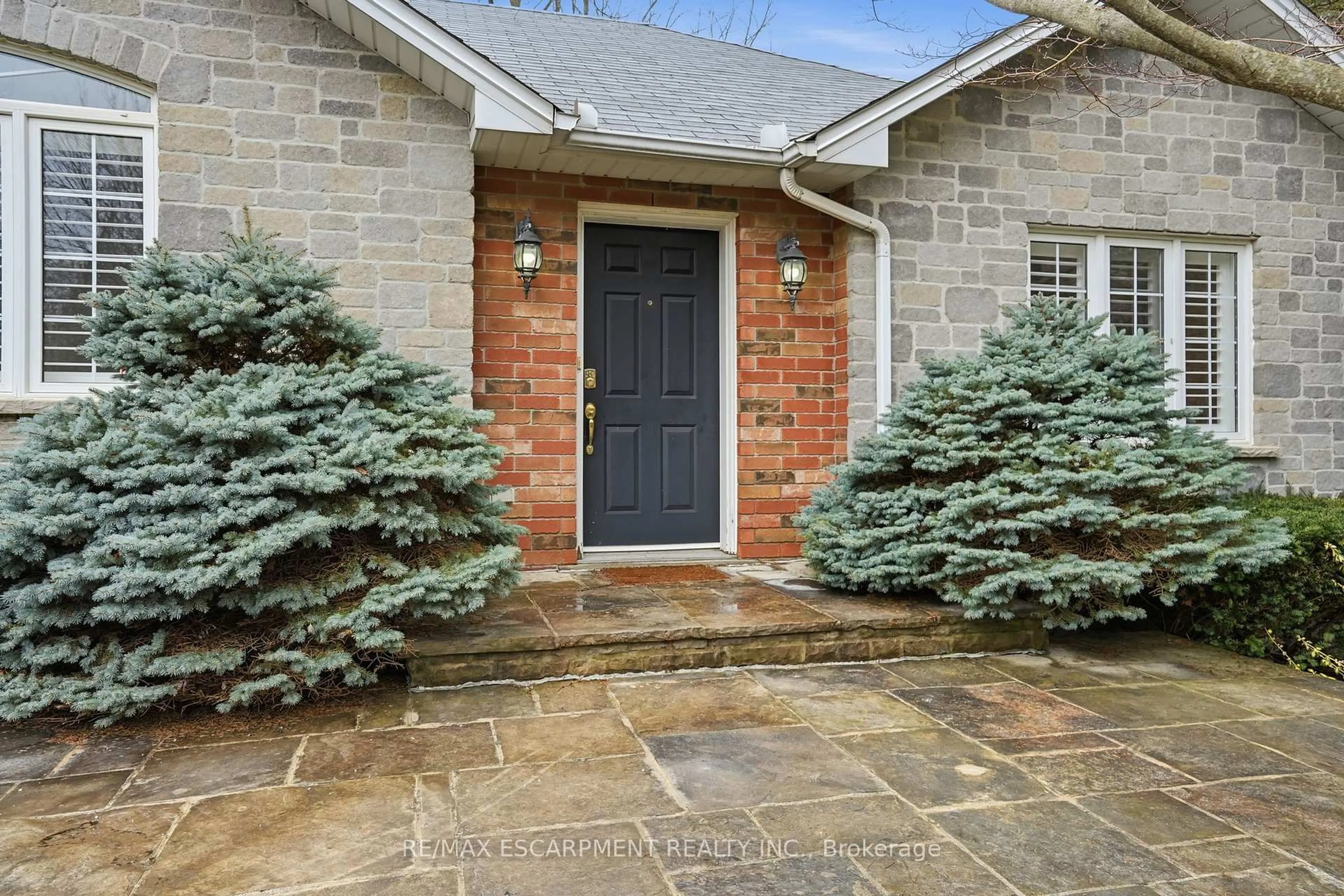 Home with brick exterior material, street for 65 Jerseyville Rd, Hamilton Ontario L9G 1K2