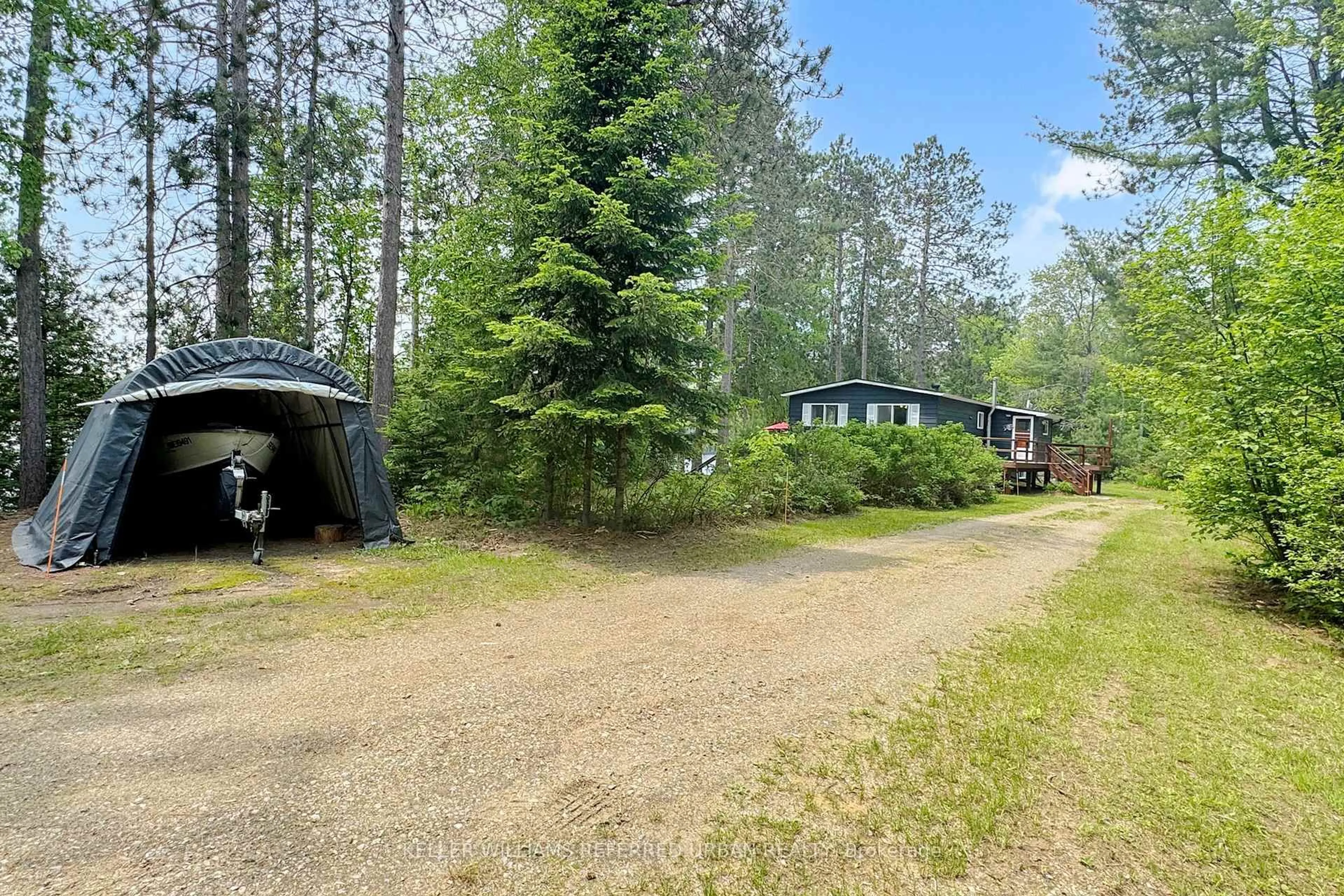 A pic from outside/outdoor area/front of a property/back of a property/a pic from drone, forest/trees view for 73 Ida Ho Lane, Bancroft Ontario K0L 1C0