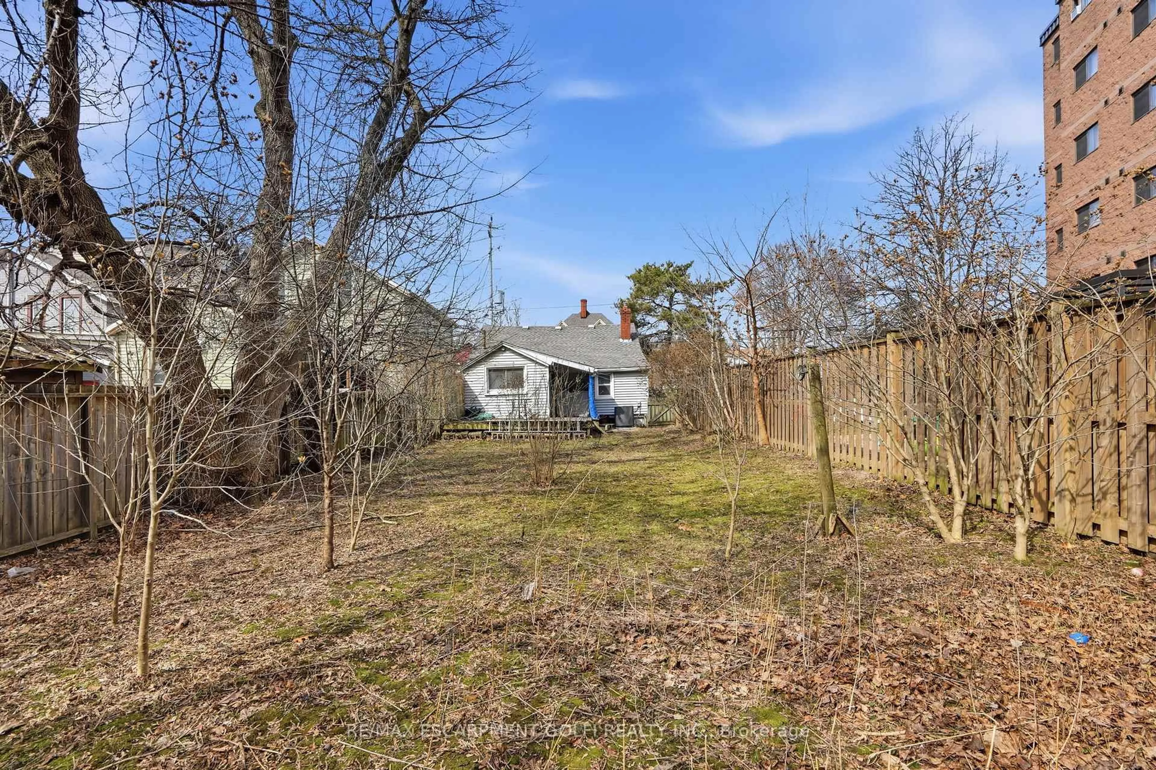 A pic from outside/outdoor area/front of a property/back of a property/a pic from drone, forest/trees view for 56 Welland Ave, St. Catharines Ontario L2R 2M5