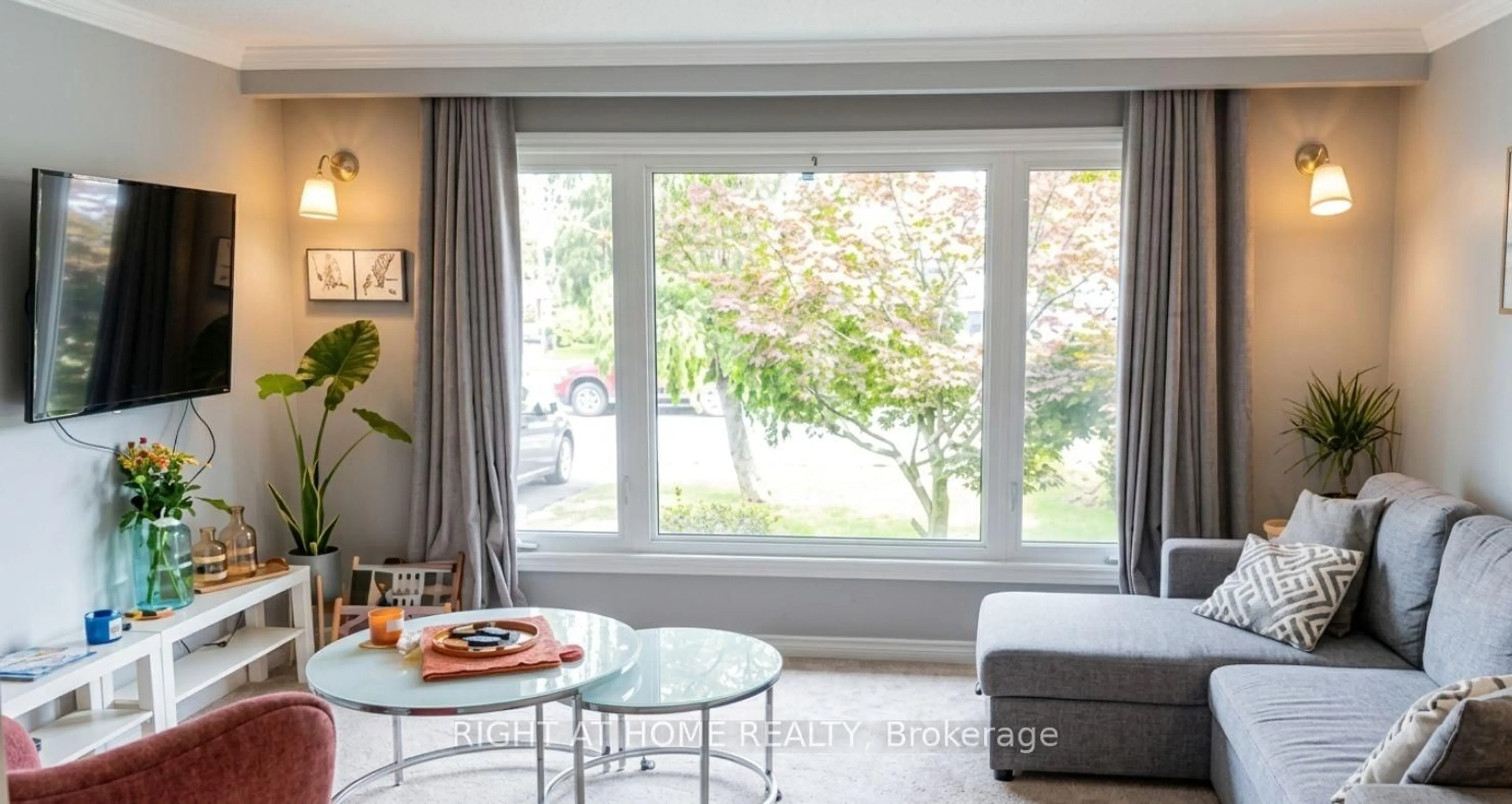 Living room with furniture, wood/laminate floor for 14 Canterbury Dr, St. Catharines Ontario L2P 3M7