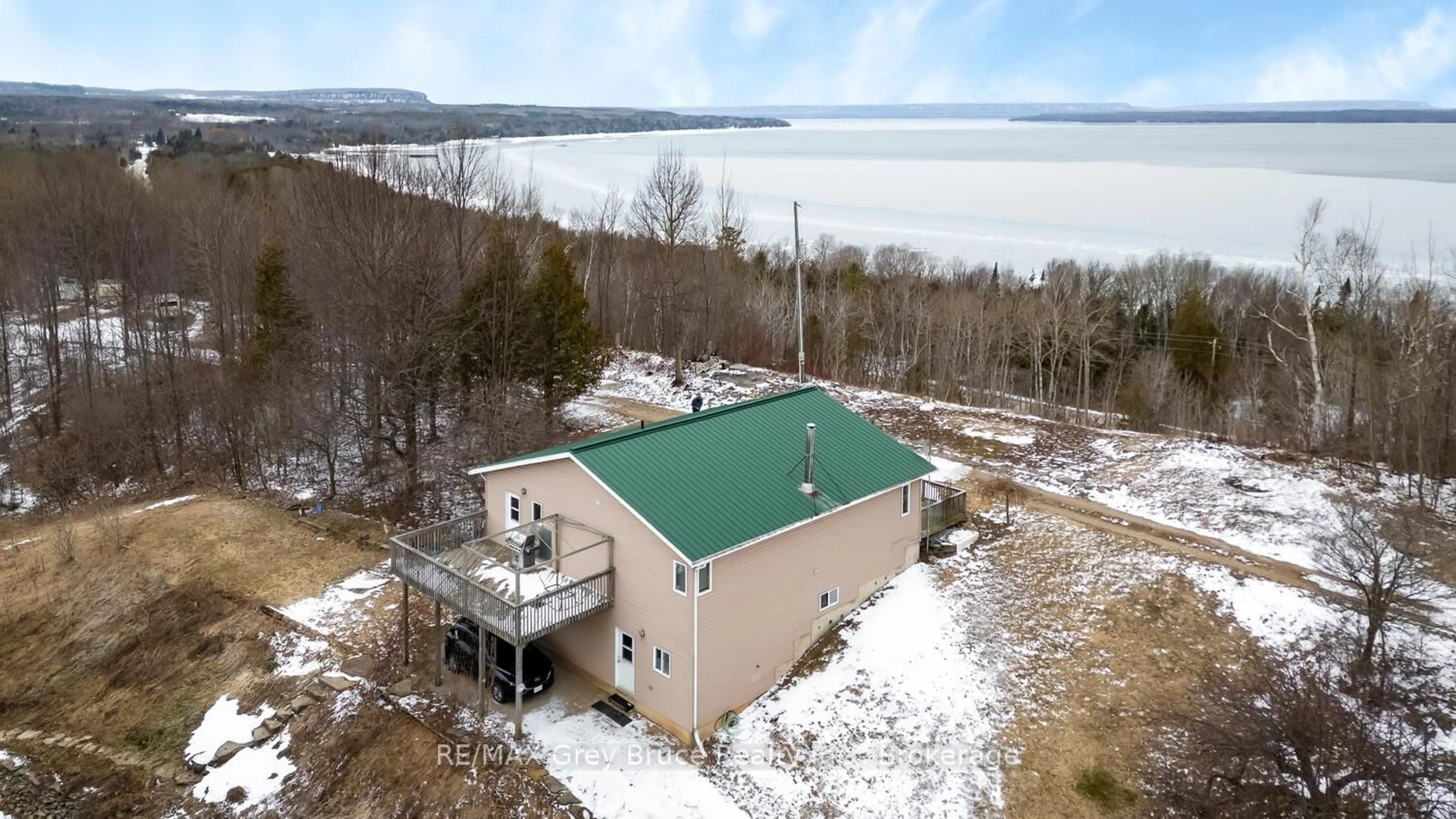 A pic from outside/outdoor area/front of a property/back of a property/a pic from drone, water/lake/river/ocean view for 504240 Grey Road 1 Rd, Georgian Bluffs Ontario N0H 2T0