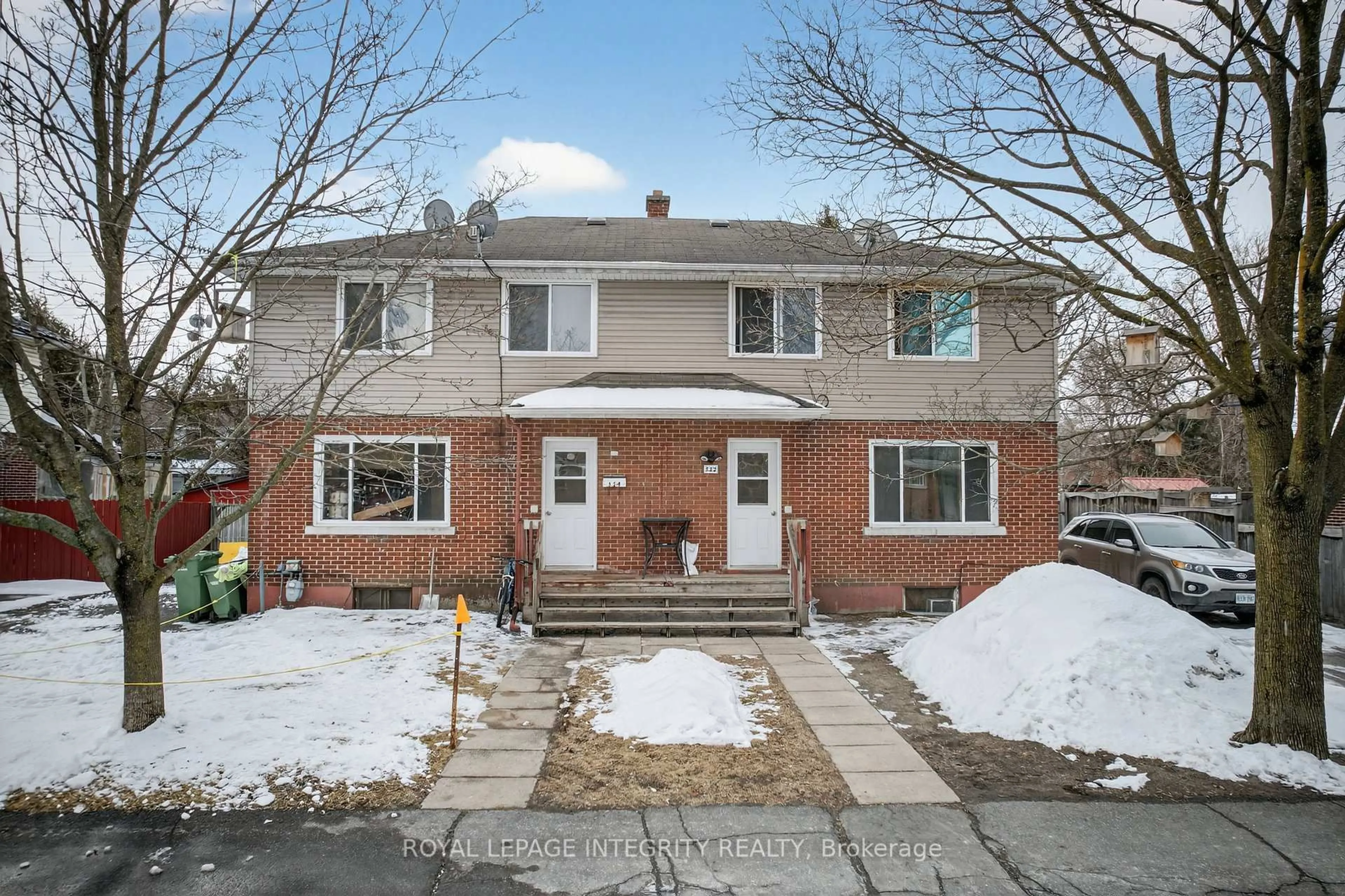 Home with brick exterior material, street for 322-324 Queen Mary St, Ottawa Ontario K1K 1W9