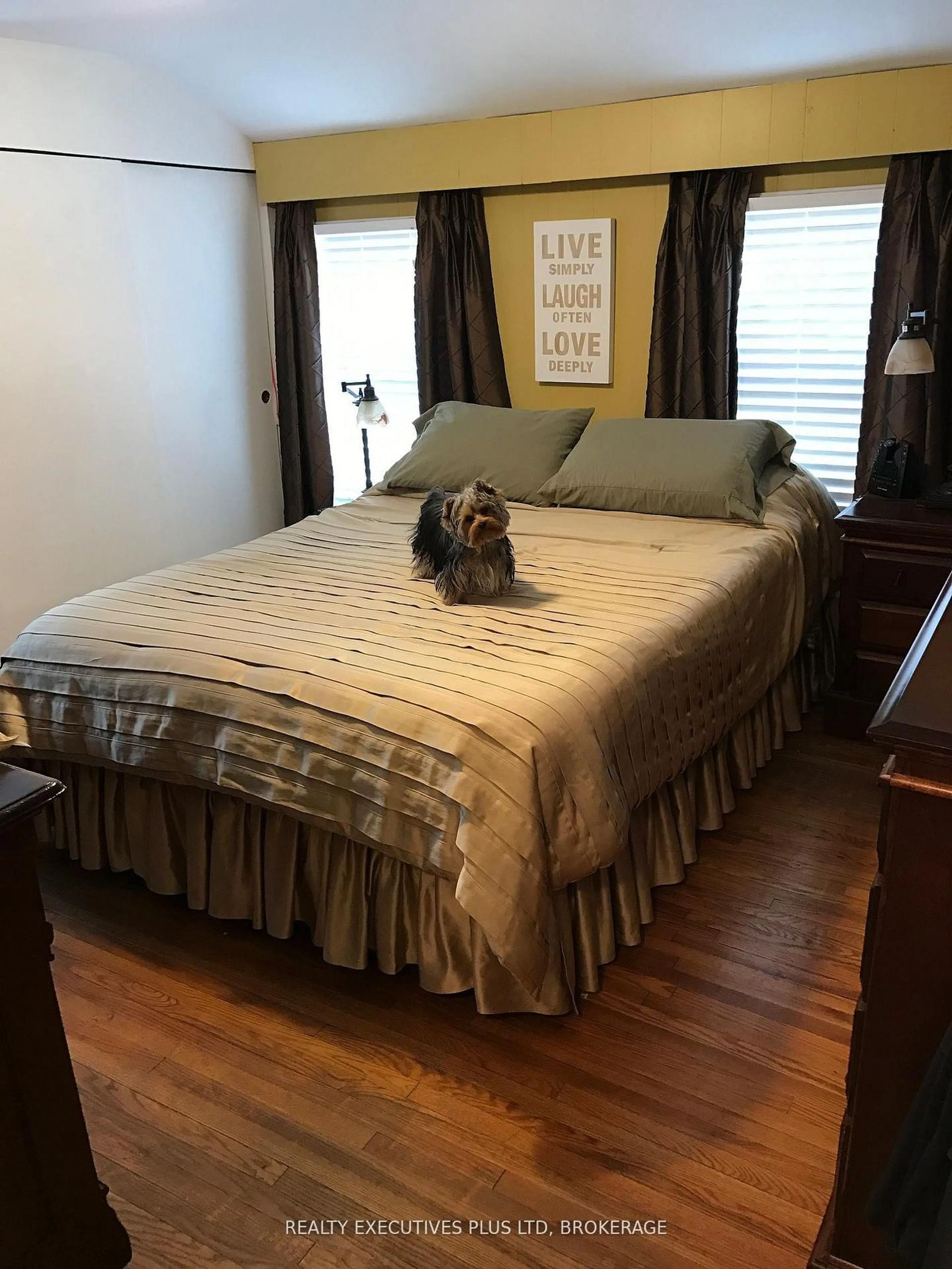 Bedroom with bed, wood/laminate floor for 4020 Main St, Niagara Falls Ontario L2G 6B8