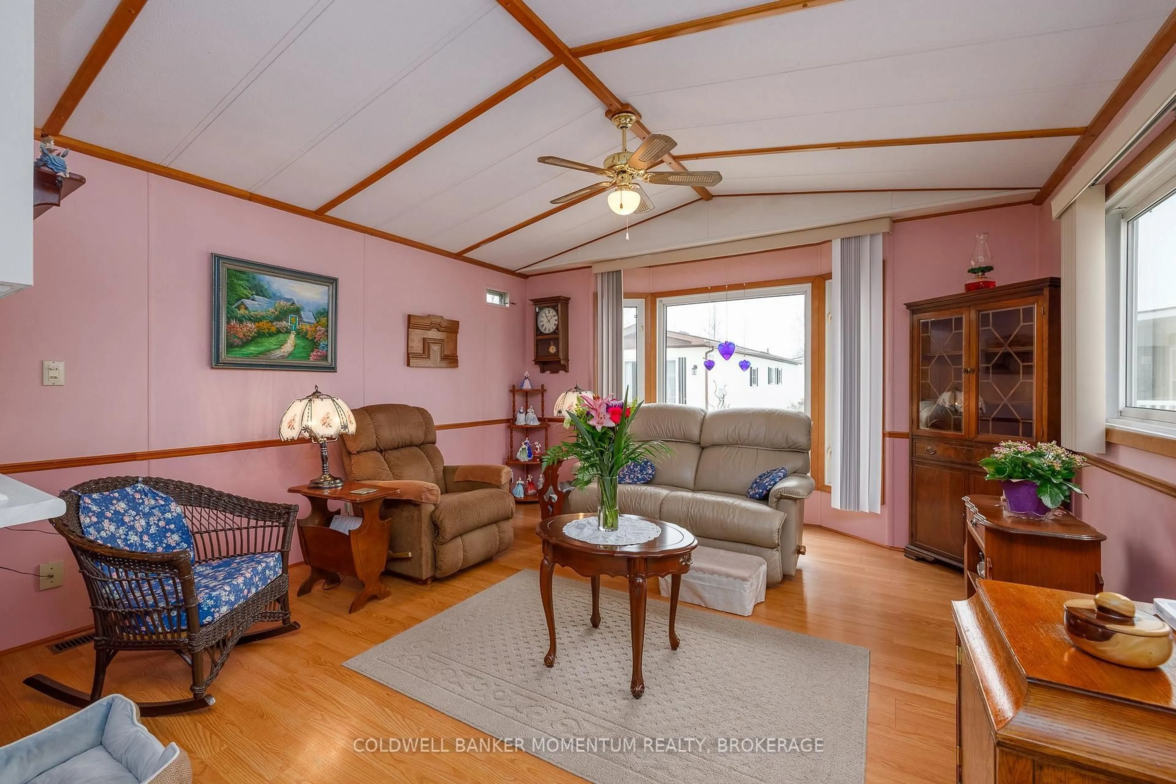 Living room with furniture, wood/laminate floor for 3033 Townline Rd #346, Fort Erie Ontario L0S 1S1