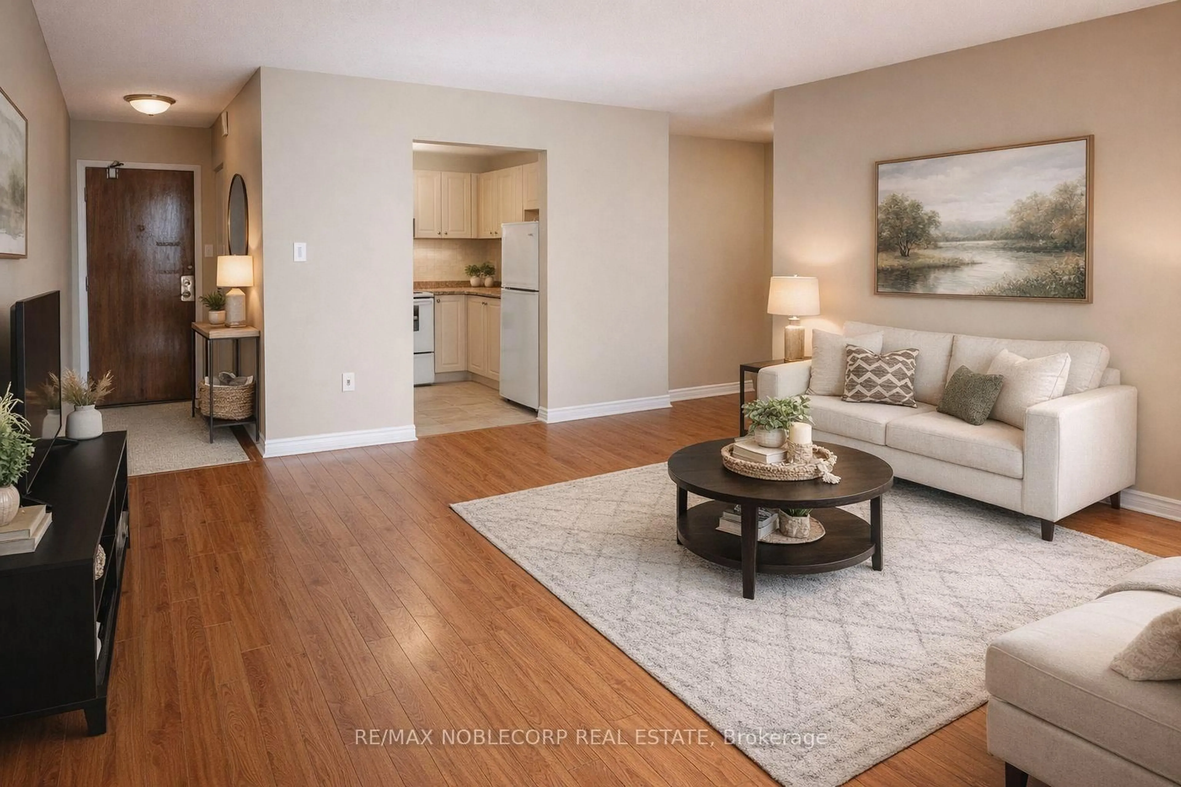 Living room with furniture, wood/laminate floor for 64 Benton St #901, Kitchener Ontario N2G 4L9