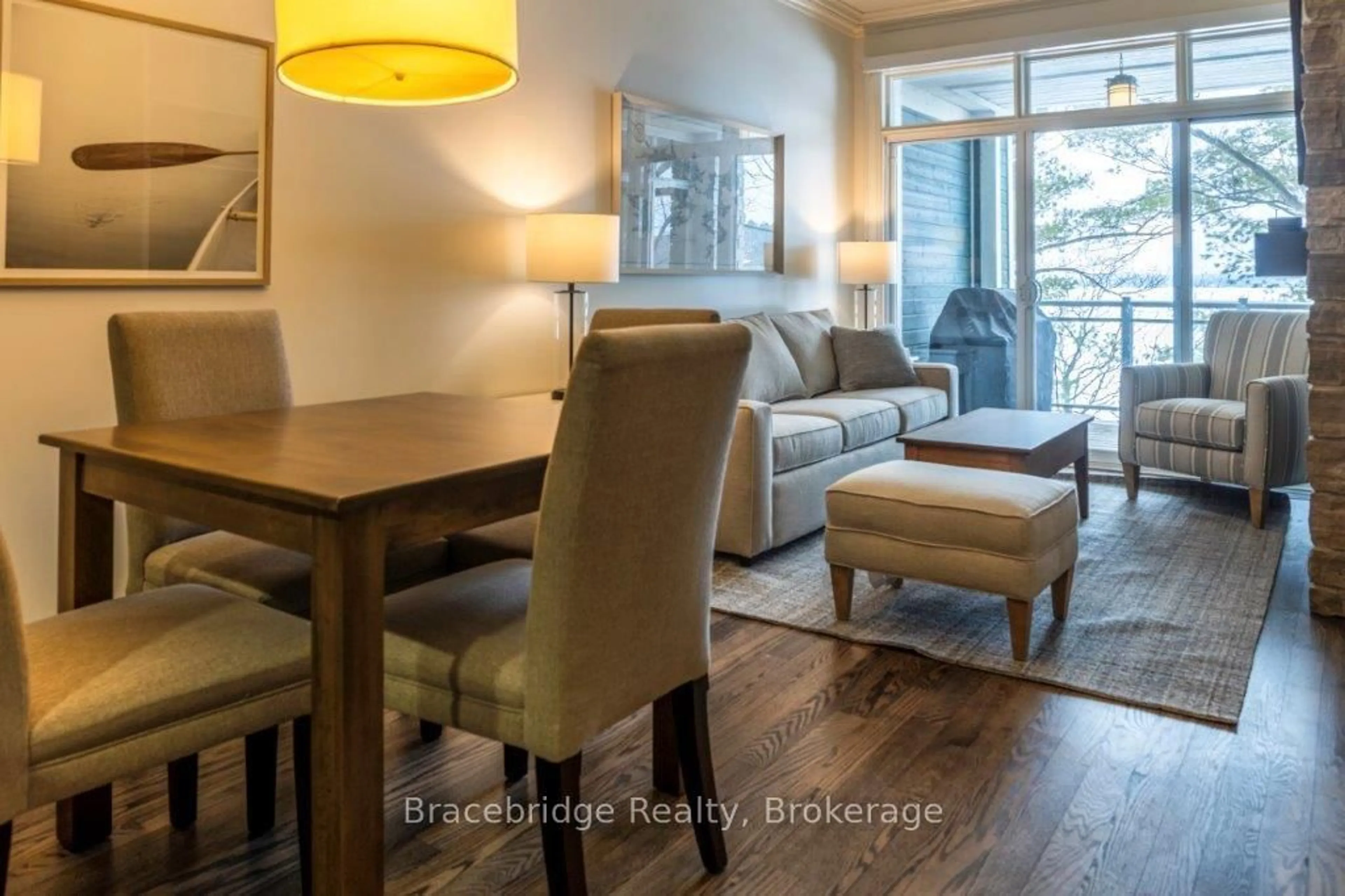 Living room with furniture, wood/laminate floor for 1869 Muskoka Rd 118 Highway #A103-D1, Muskoka Lakes Ontario P1L 1W8