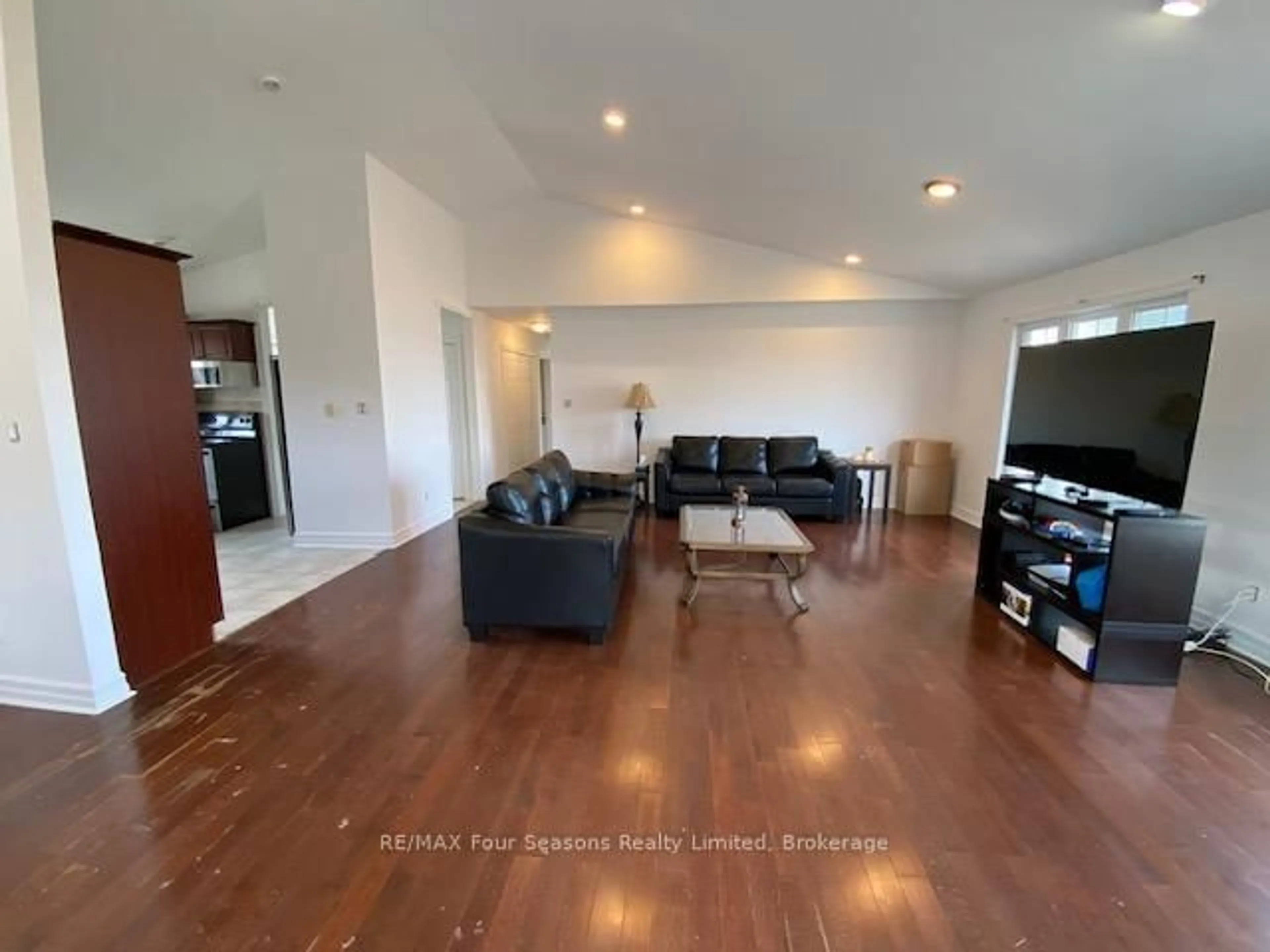 Living room with furniture, wood/laminate floor for 209442 Highway 26, Blue Mountains Ontario L9Y 0T1