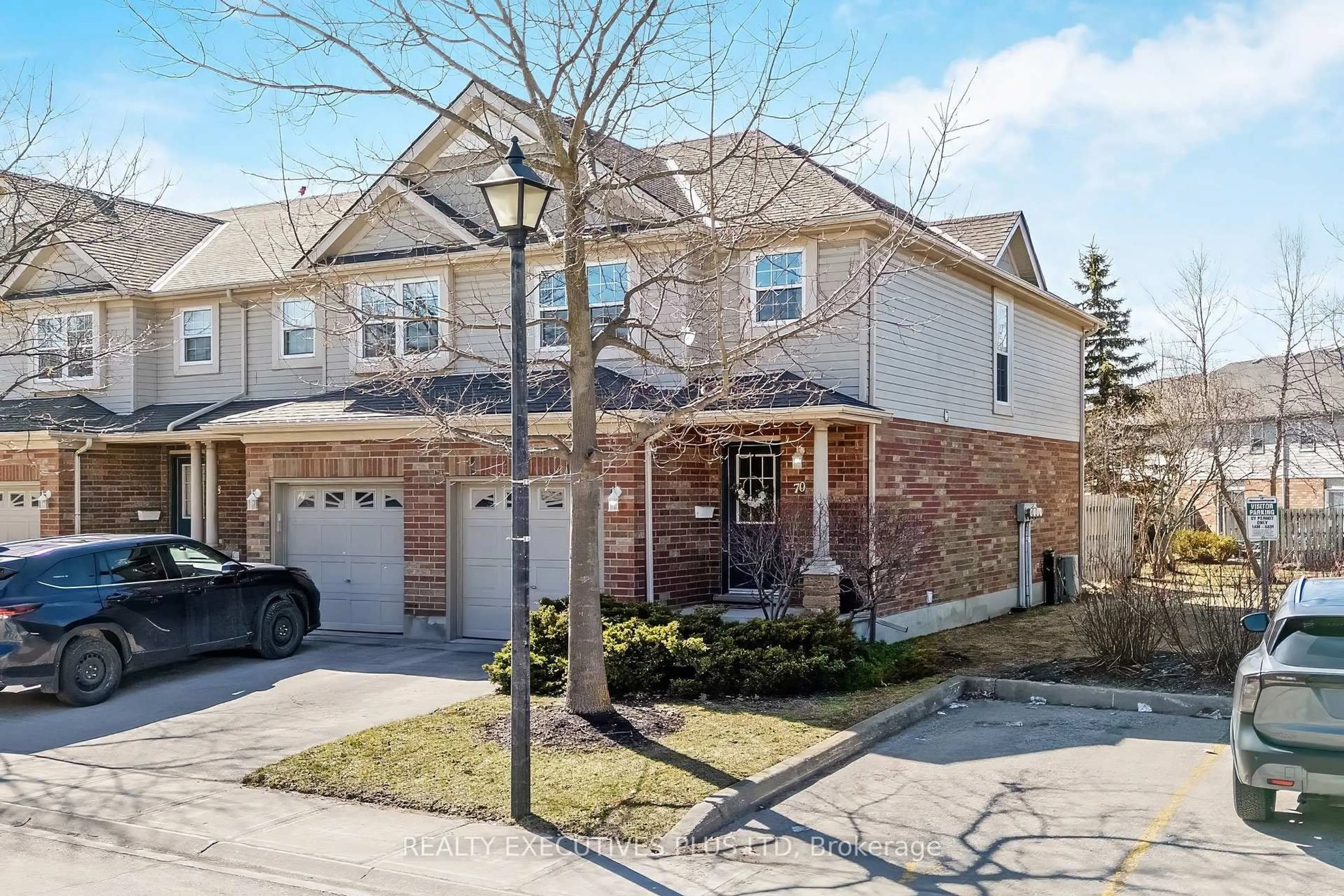 Home with brick exterior material, street for 30 Imperial Rd #70, Guelph Ontario N1K 1Y2