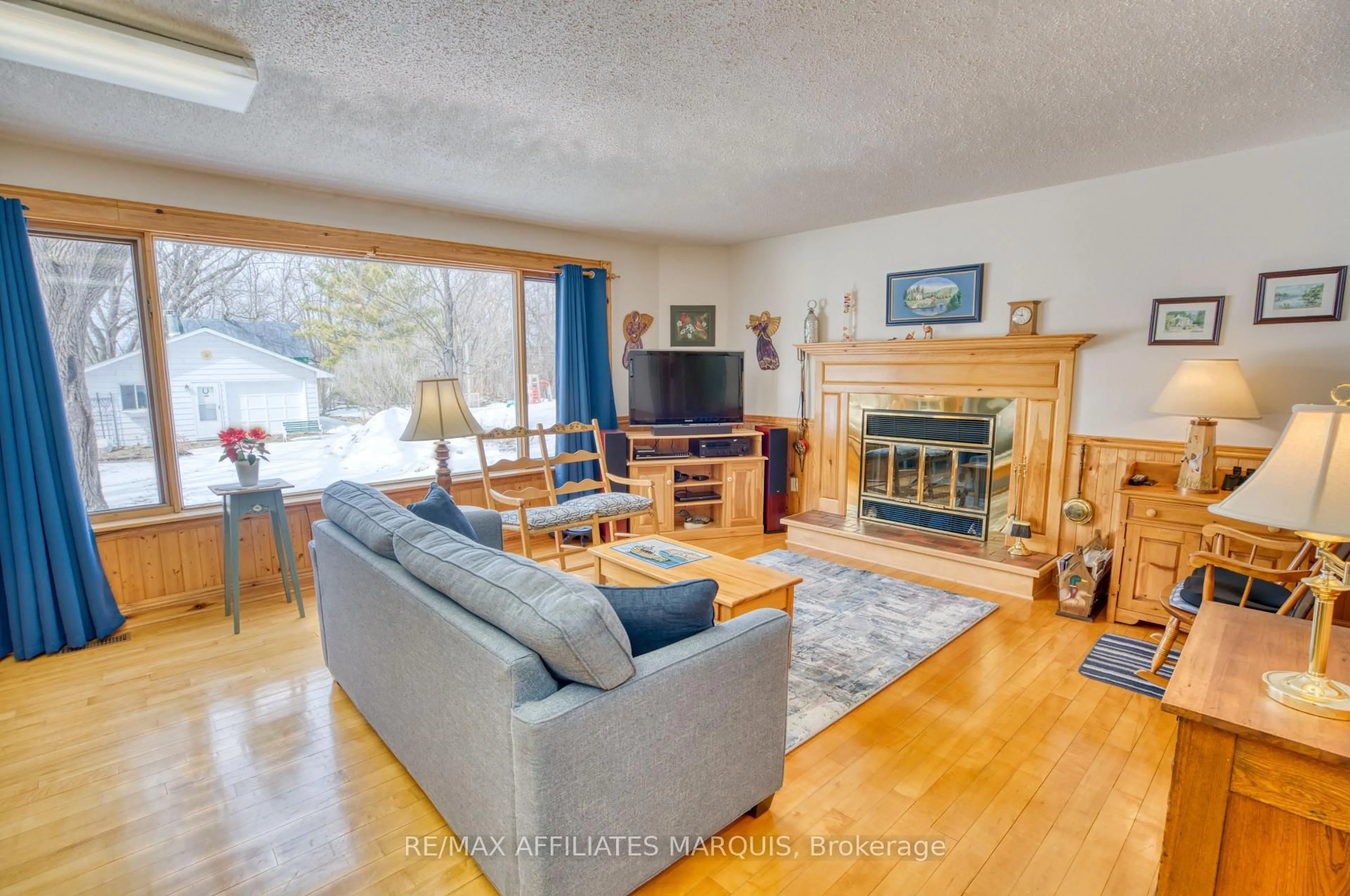 Living room with furniture, wood/laminate floor for 34 Church St, Westport Ontario K0G 1X0