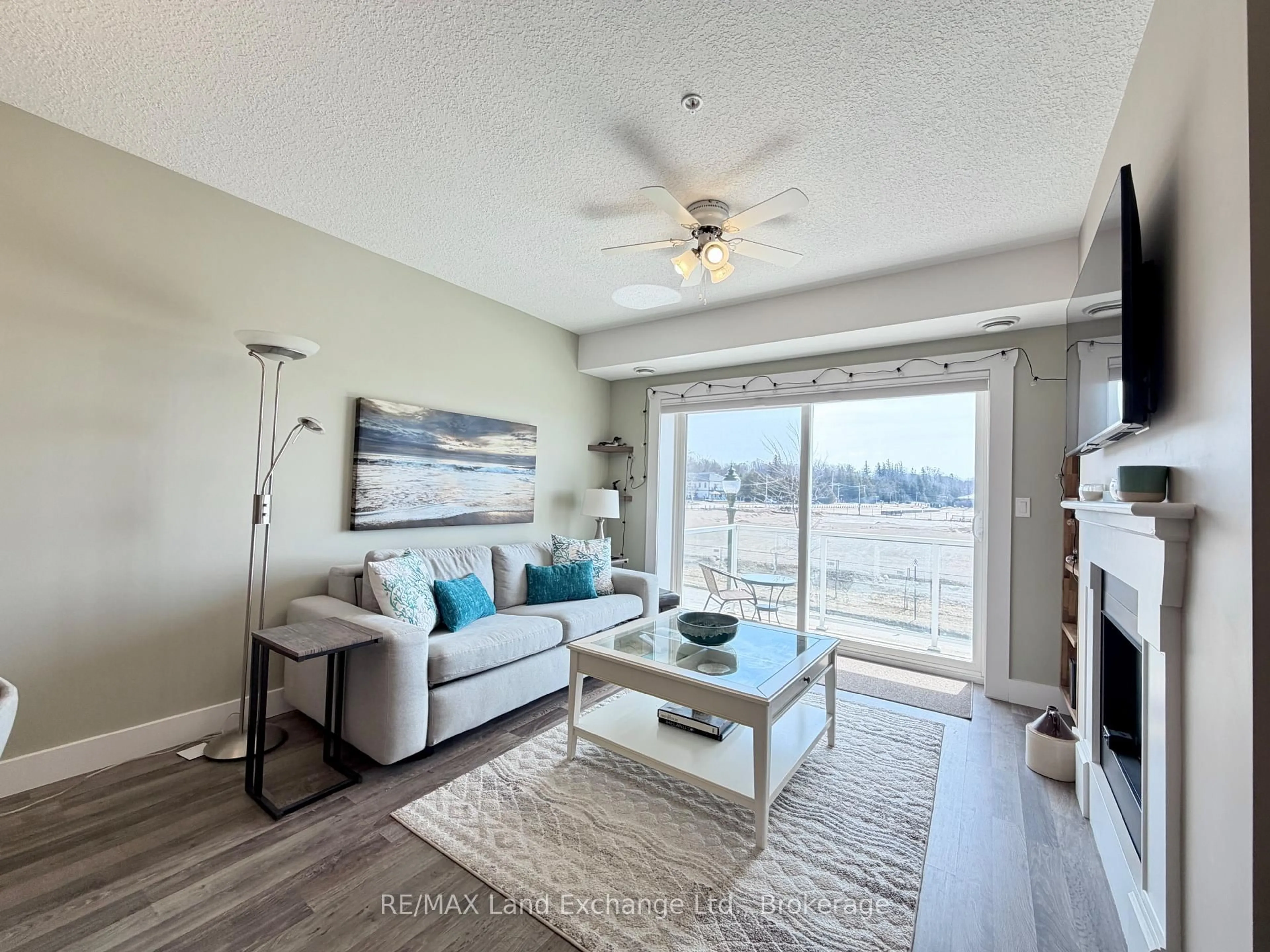 Living room with furniture, wood/laminate floor for 137 ELGIN St #203, Saugeen Shores Ontario N0H 2C6