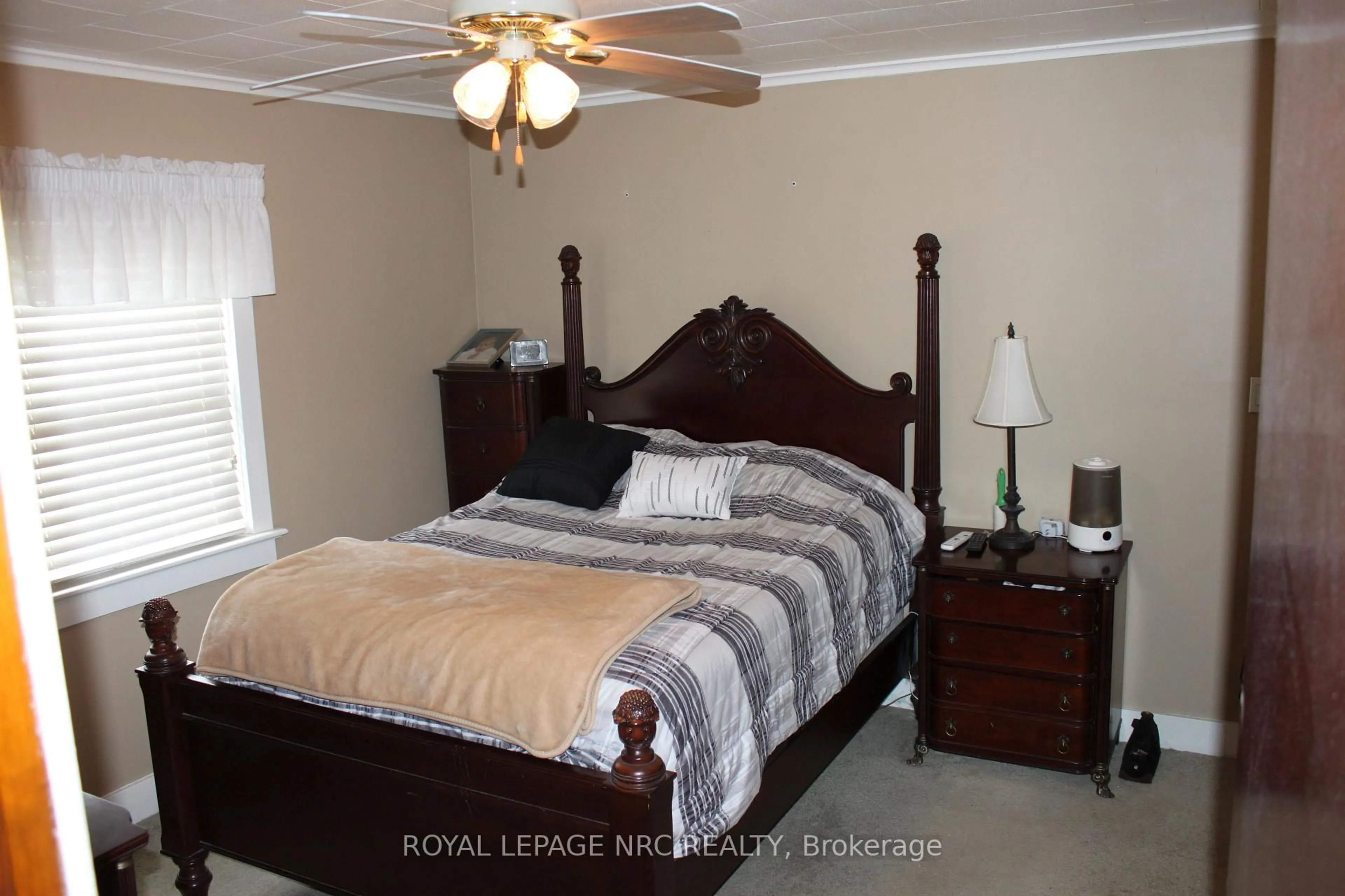 Bedroom with bed, wood/laminate floor for 3780 Dominion Rd, Fort Erie Ontario L0S 1N0