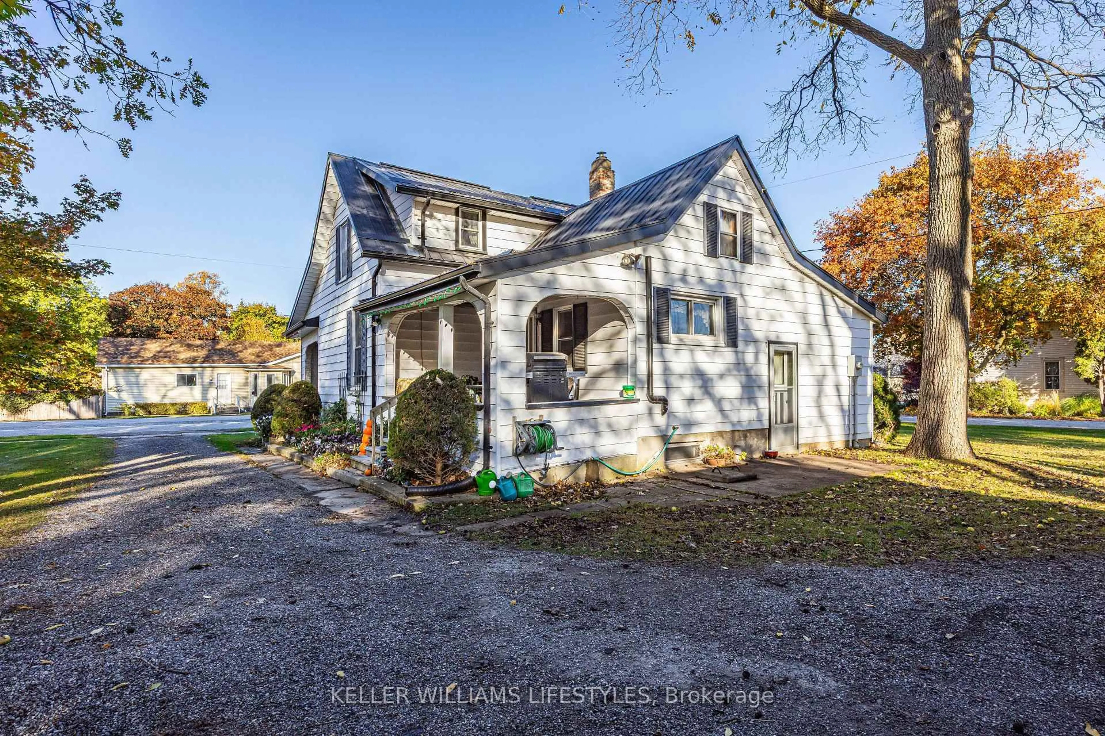 A pic from outside/outdoor area/front of a property/back of a property/a pic from drone, street for 136 Queen St, North Middlesex Ontario N0M 1A0