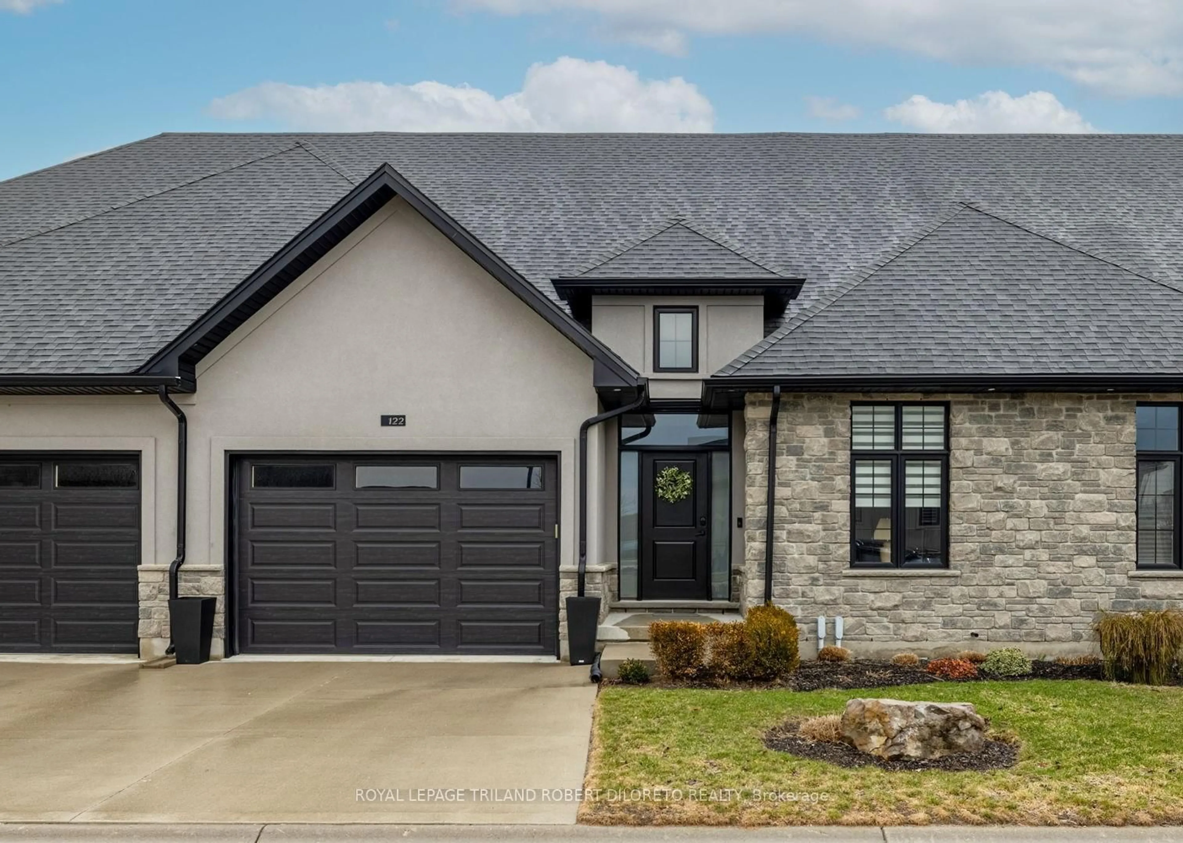 Home with brick exterior material, street for 9861 GLENDON Dr #122, Middlesex Centre Ontario N0L 1R0