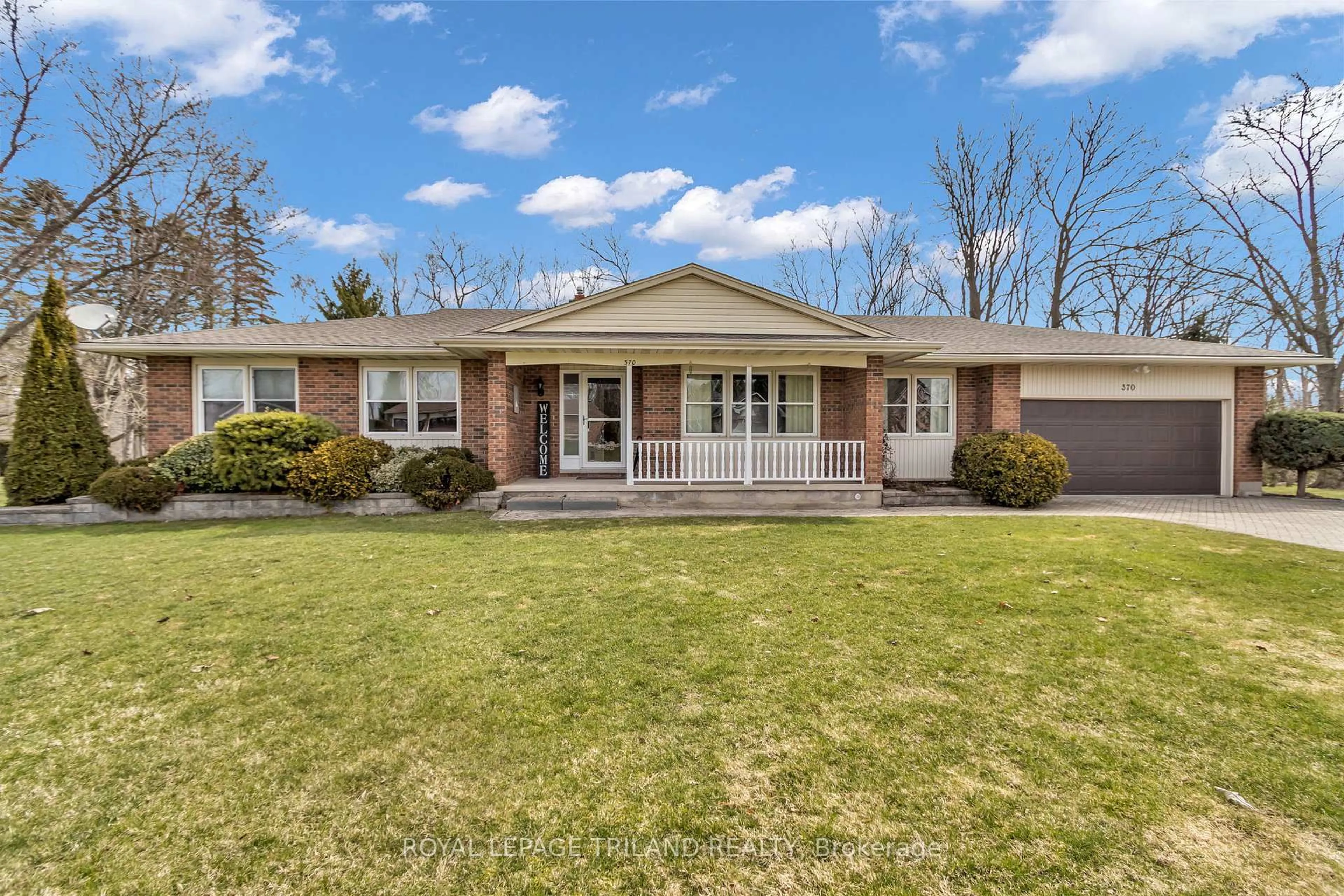 Home with vinyl exterior material, street for 370 STATION St, North Middlesex Ontario N0M 2K0