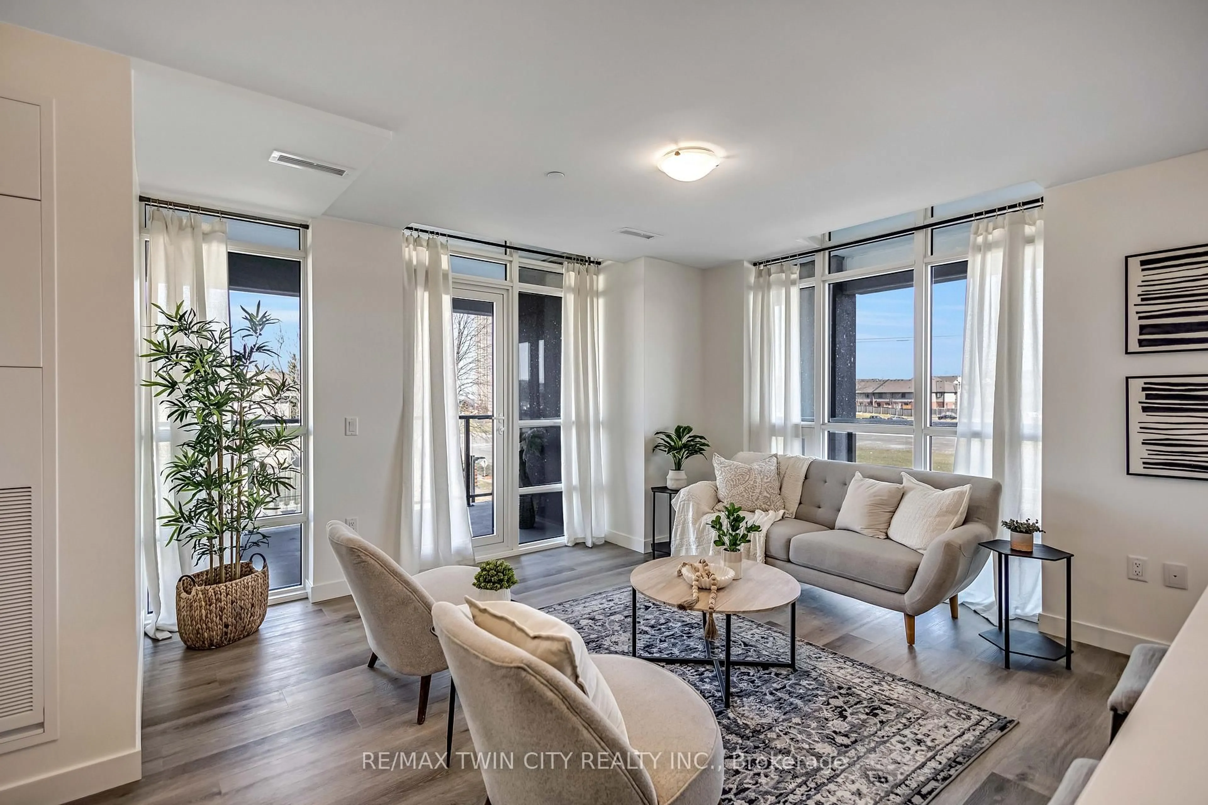 Living room with furniture, unknown for 461 Green Rd #212, Hamilton Ontario L8E 0L5