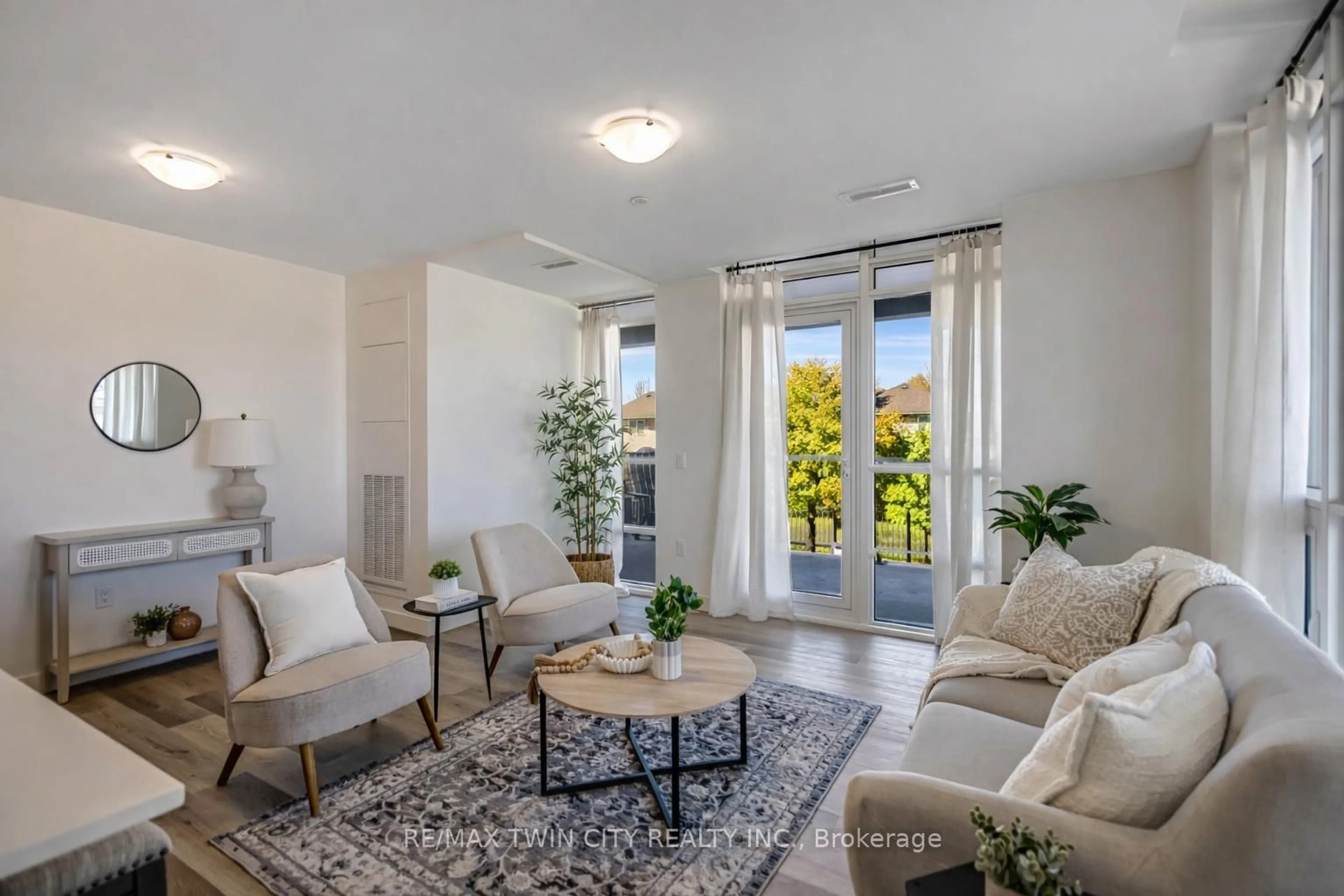 Living room with furniture, unknown for 461 Green Rd #212, Hamilton Ontario L8E 0L5