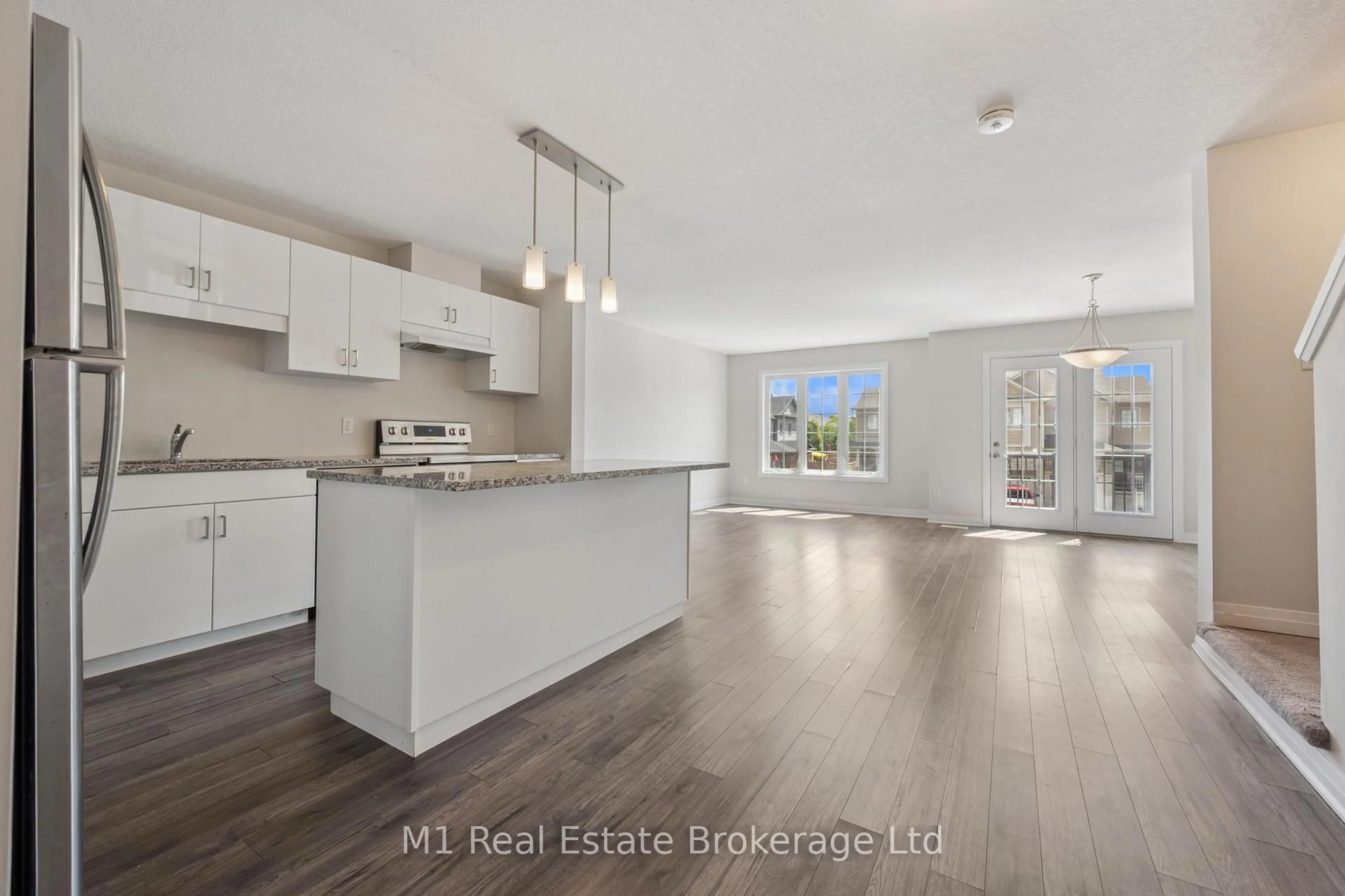 Open concept kitchen, wood/laminate floor for 13 Meadowridge St, Kitchener Ontario N2P 0H2