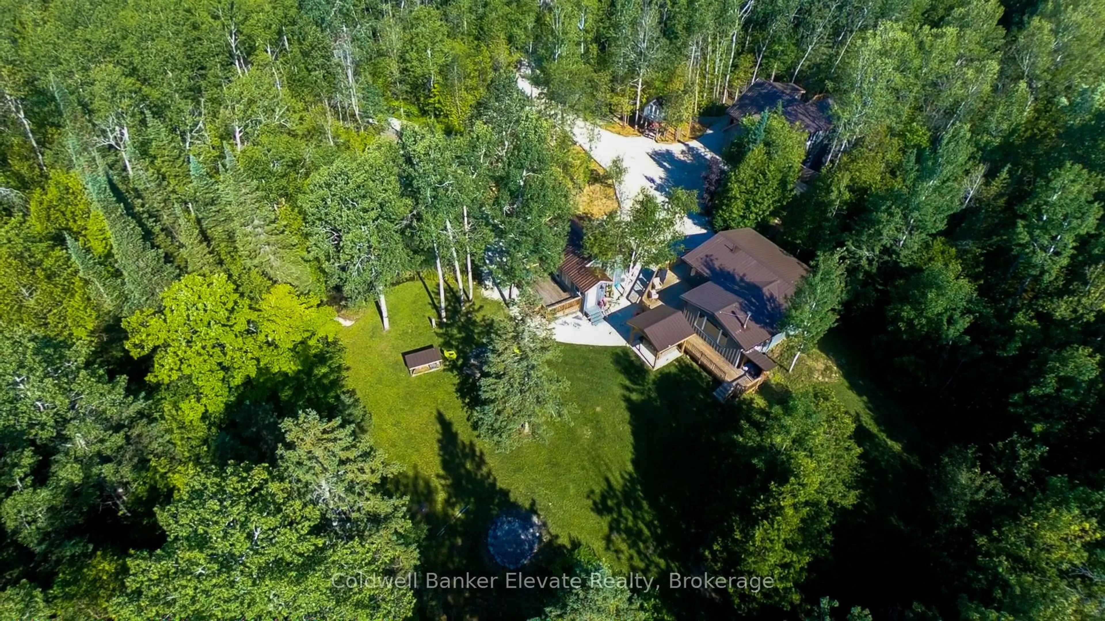 A pic from outside/outdoor area/front of a property/back of a property/a pic from drone, forest/trees view for 102 Cape Chin North Rd, Northern Bruce Peninsula Ontario N0H 1W0