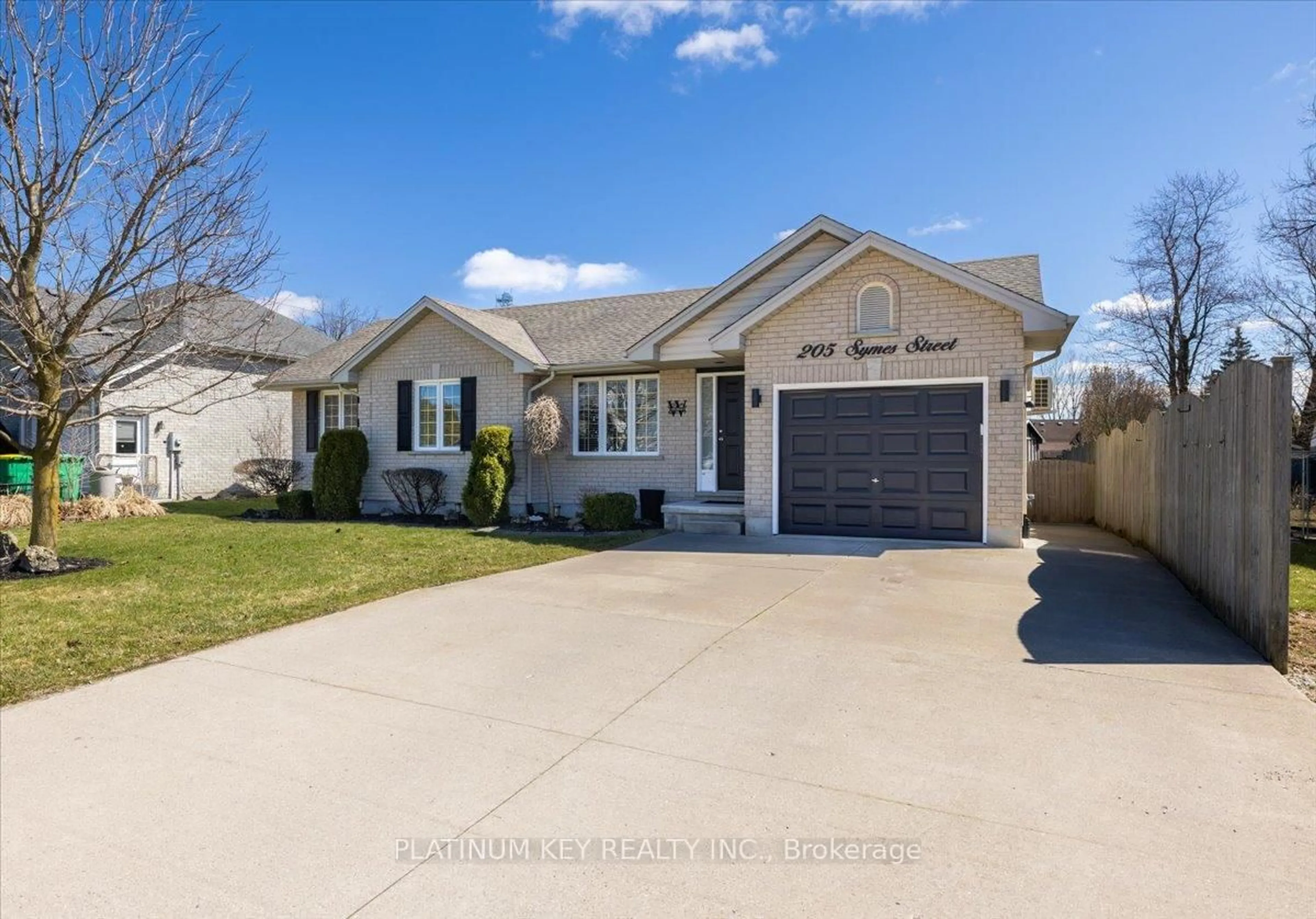 Home with vinyl exterior material, street for 205 Symes St, Southwest Middlesex Ontario N0L 1M0