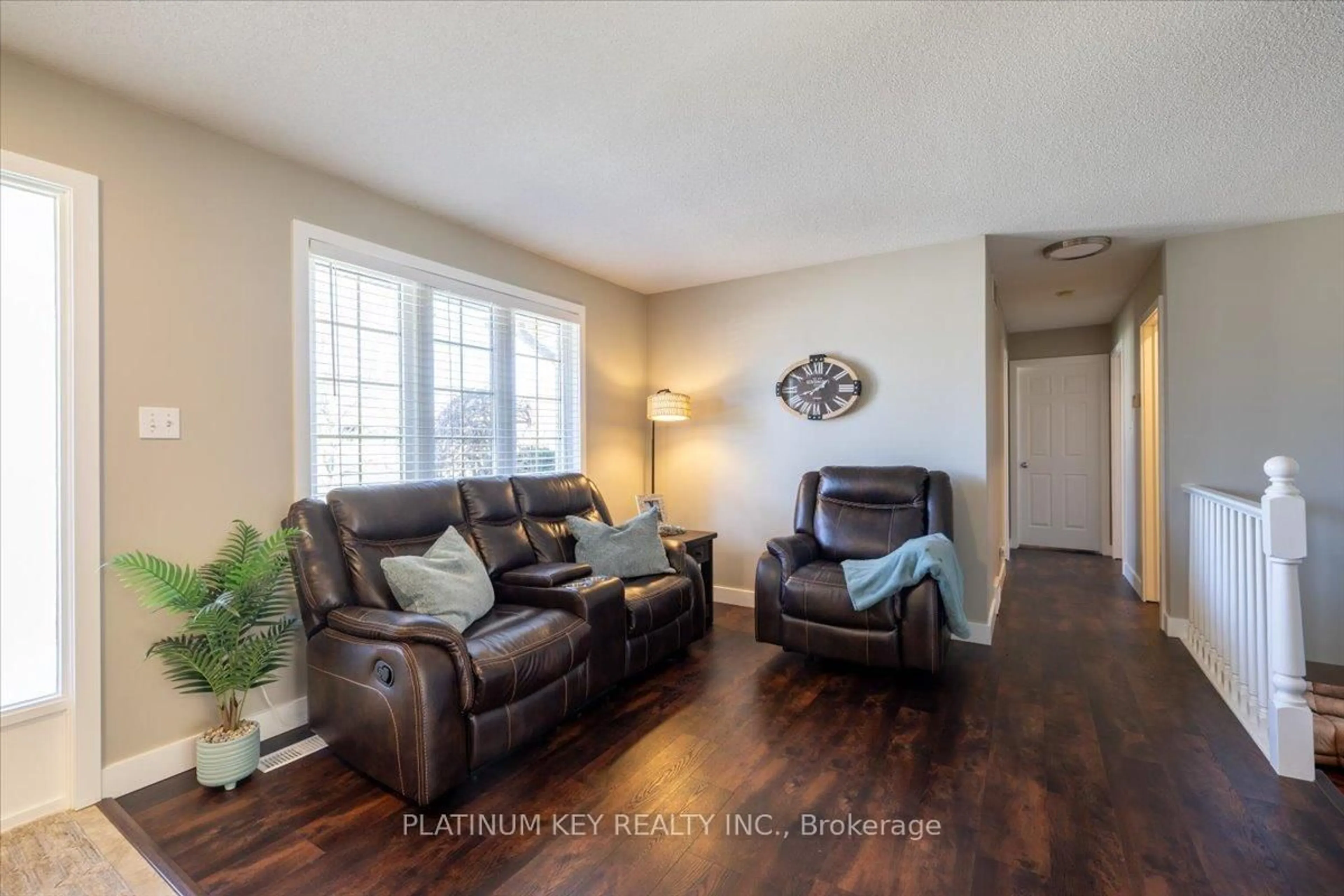 Living room with furniture, wood/laminate floor for 205 Symes St, Southwest Middlesex Ontario N0L 1M0