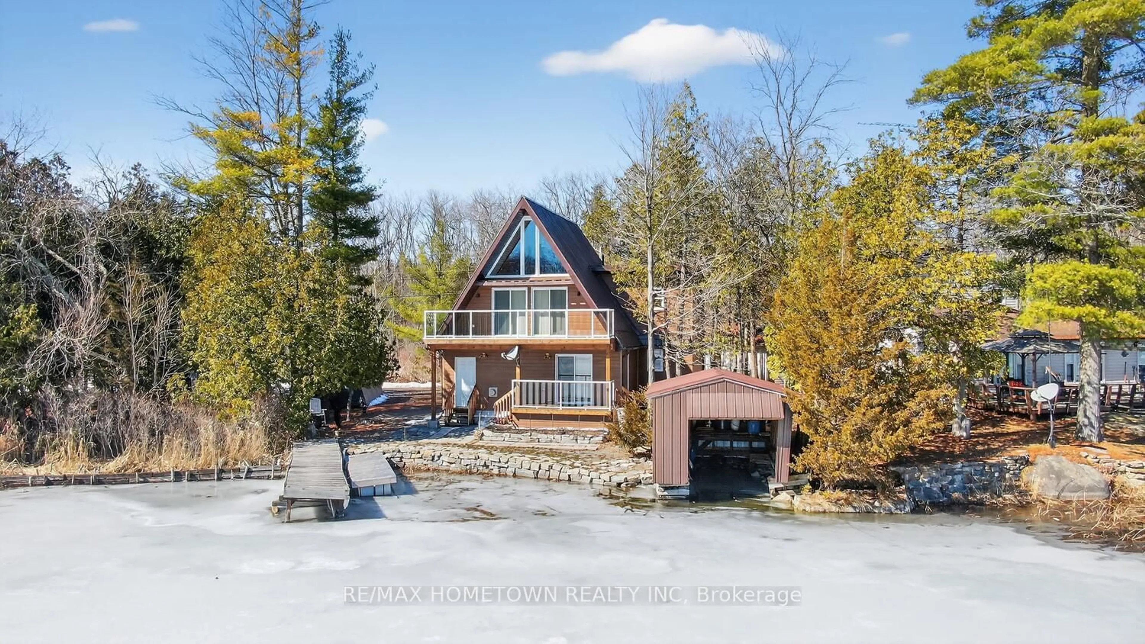 A pic from outside/outdoor area/front of a property/back of a property/a pic from drone, water/lake/river/ocean view for 304 Hay Bay Lane, Leeds and the Thousand Islands Ontario K0E 1L0