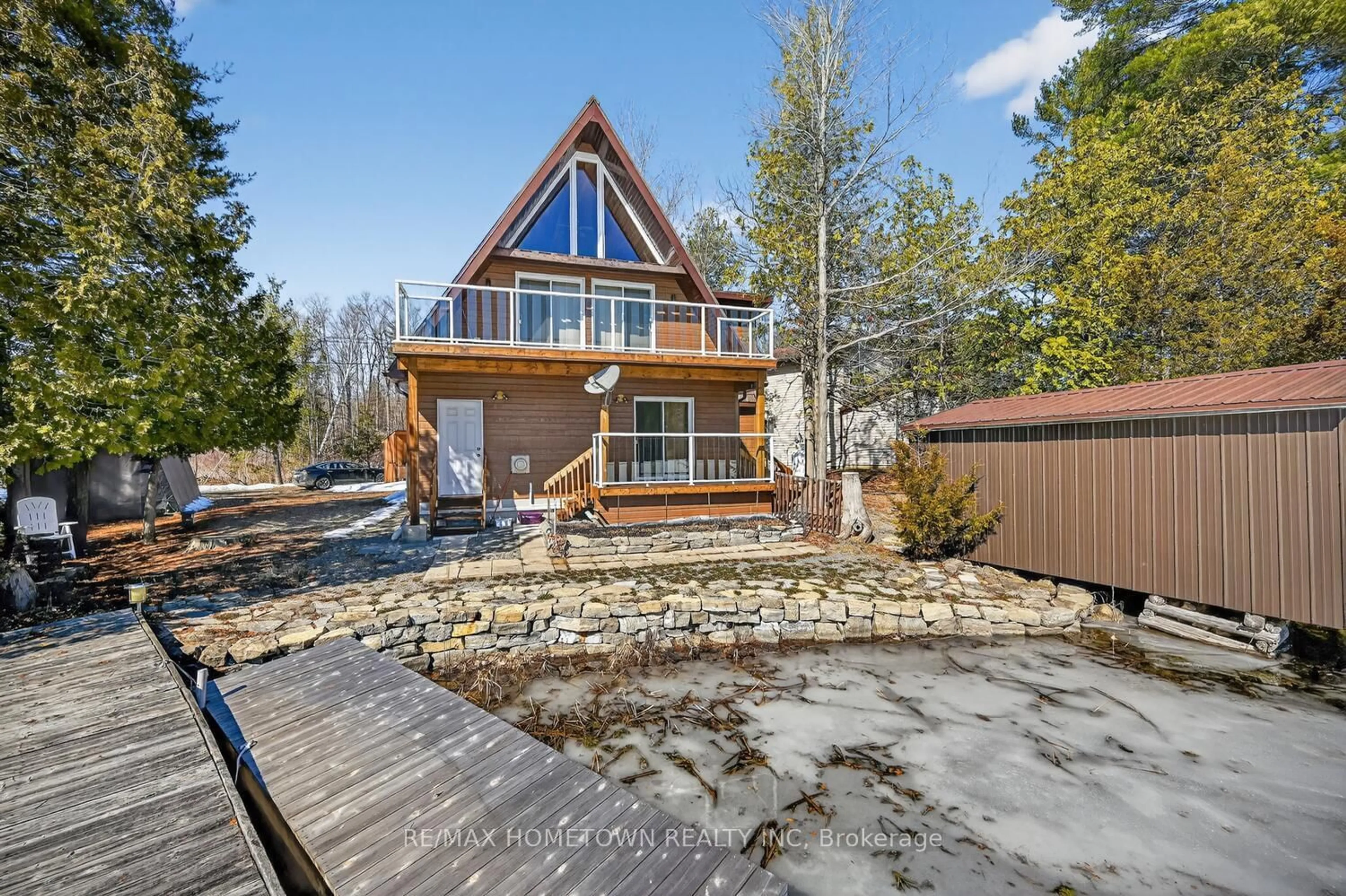 A pic from outside/outdoor area/front of a property/back of a property/a pic from drone, unknown for 304 Hay Bay Lane, Leeds and the Thousand Islands Ontario K0E 1L0