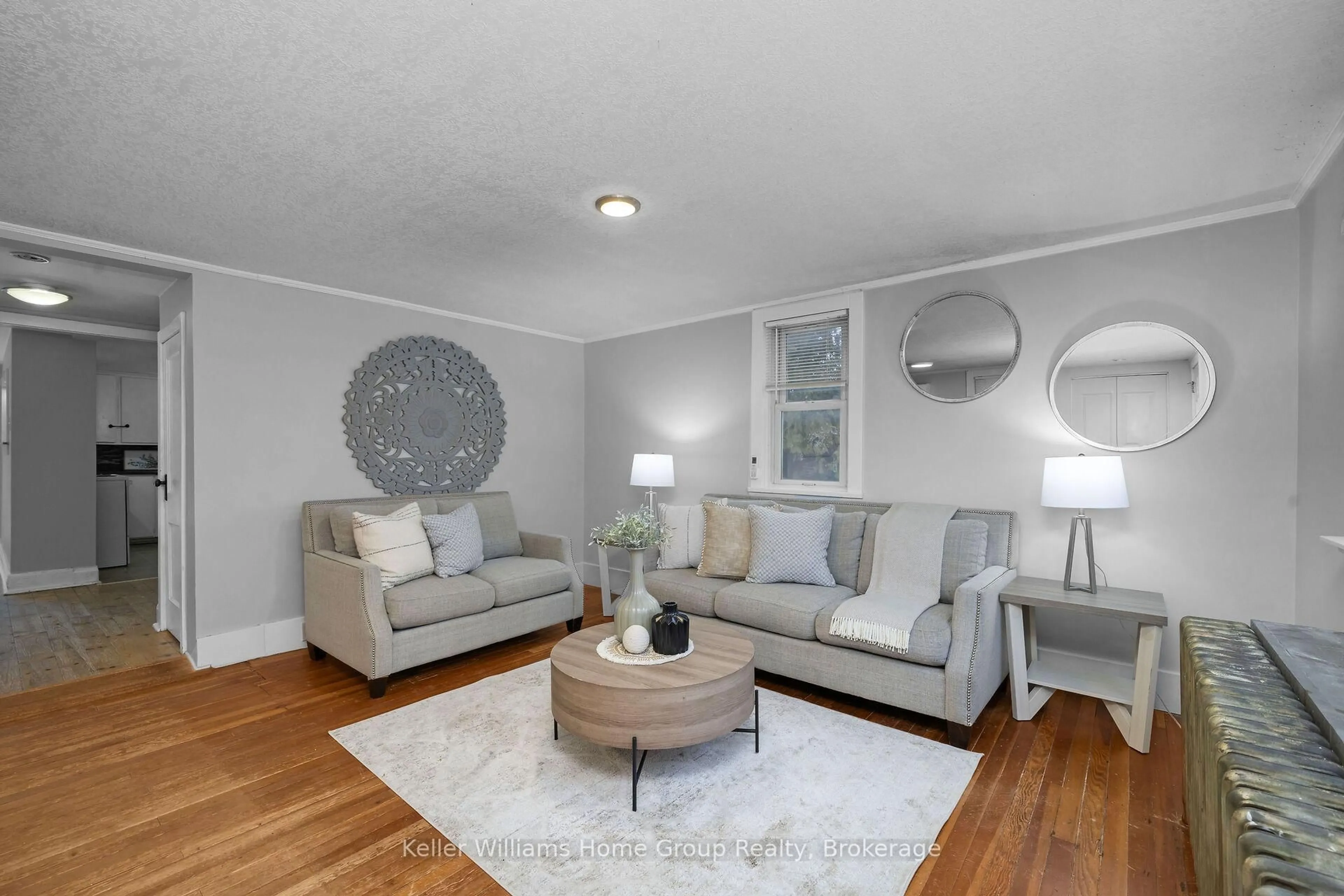 Living room with furniture, wood/laminate floor for 75 Wellesley St, Centre Wellington Ontario N0B 1S0