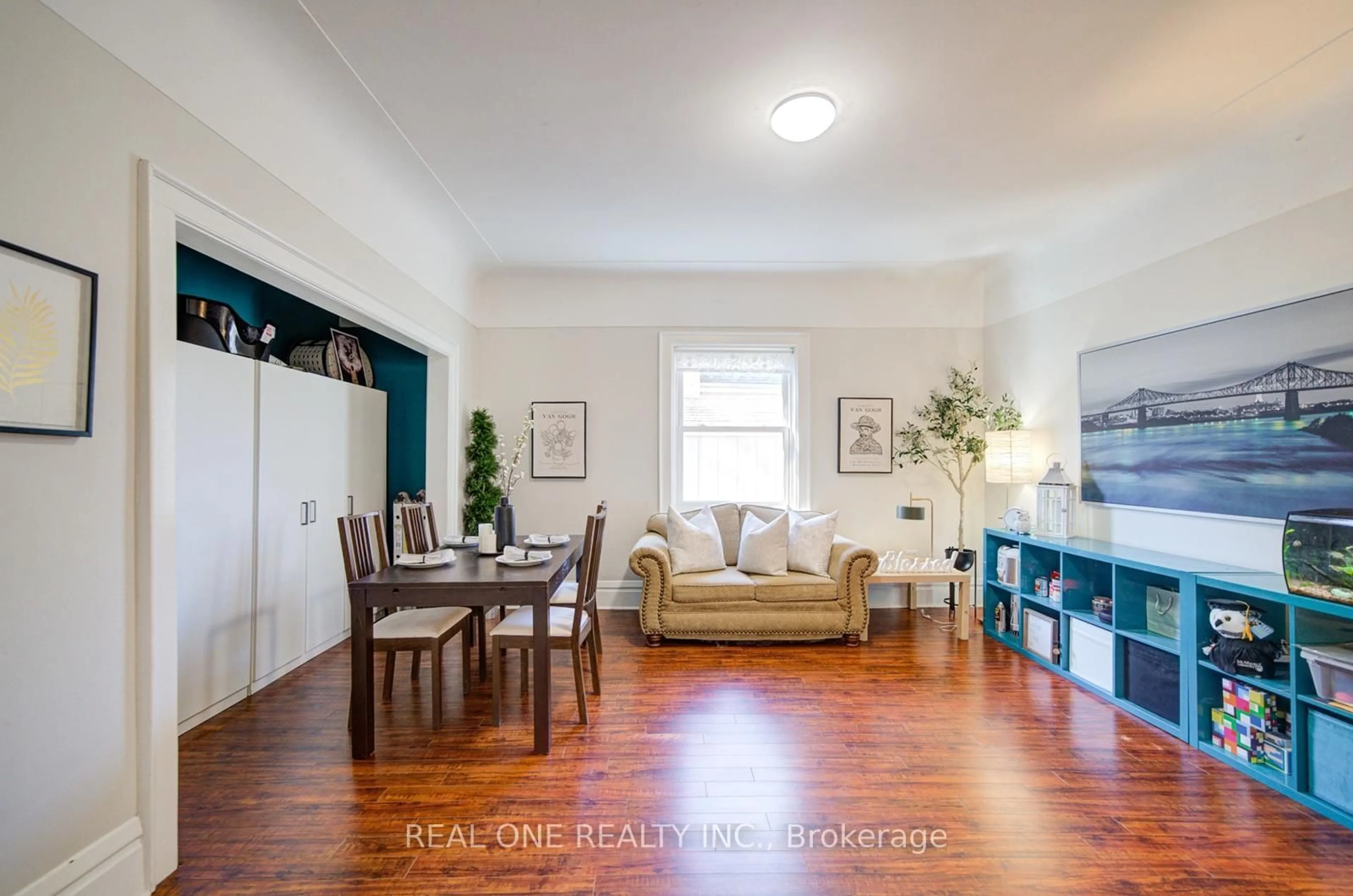 Living room with furniture, wood/laminate floor for 102 Royal Ave, Hamilton Ontario L8S 2C6