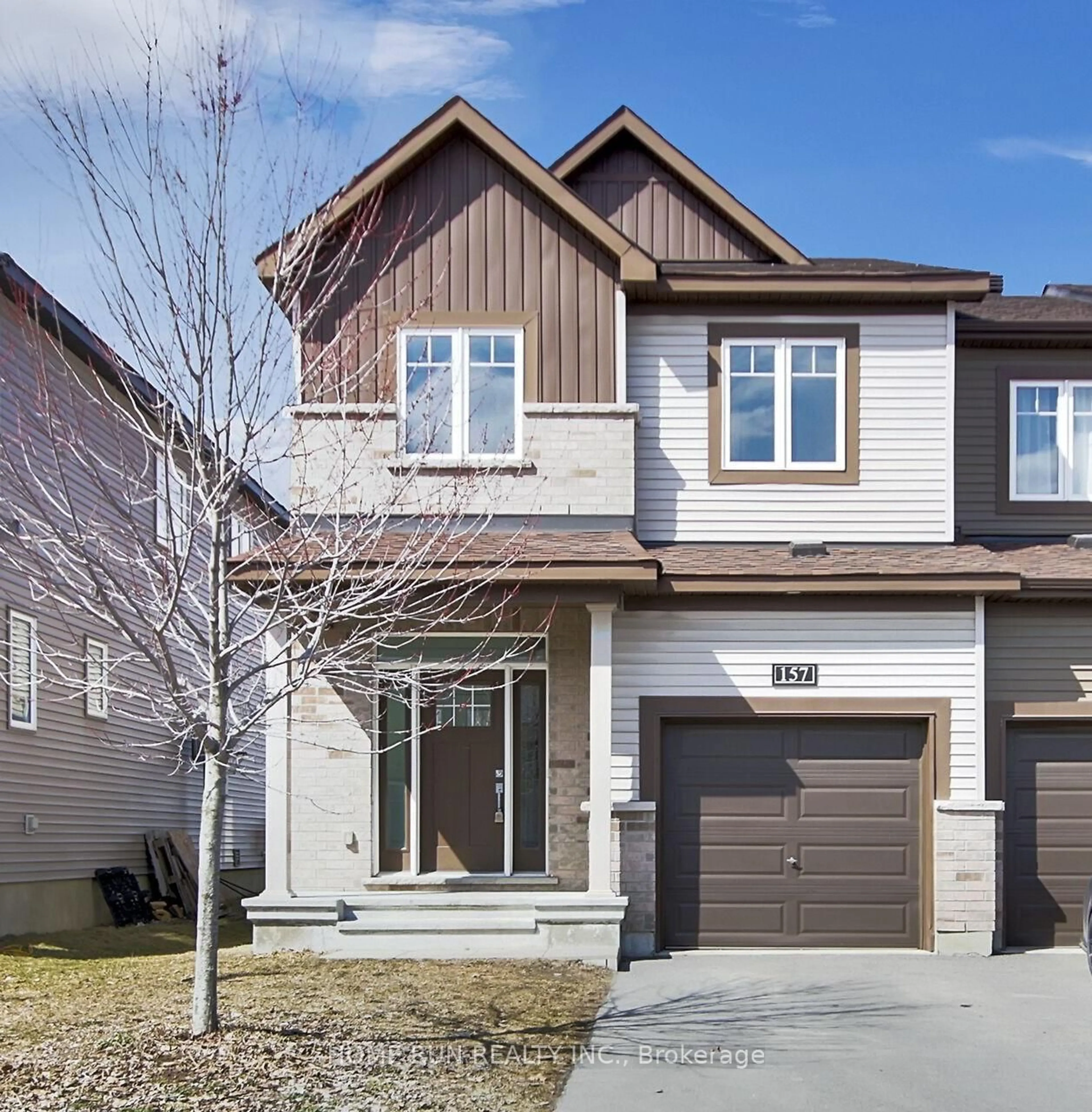 Home with brick exterior material, street for 157 Bending Way, Ottawa Ontario K2J 6N9