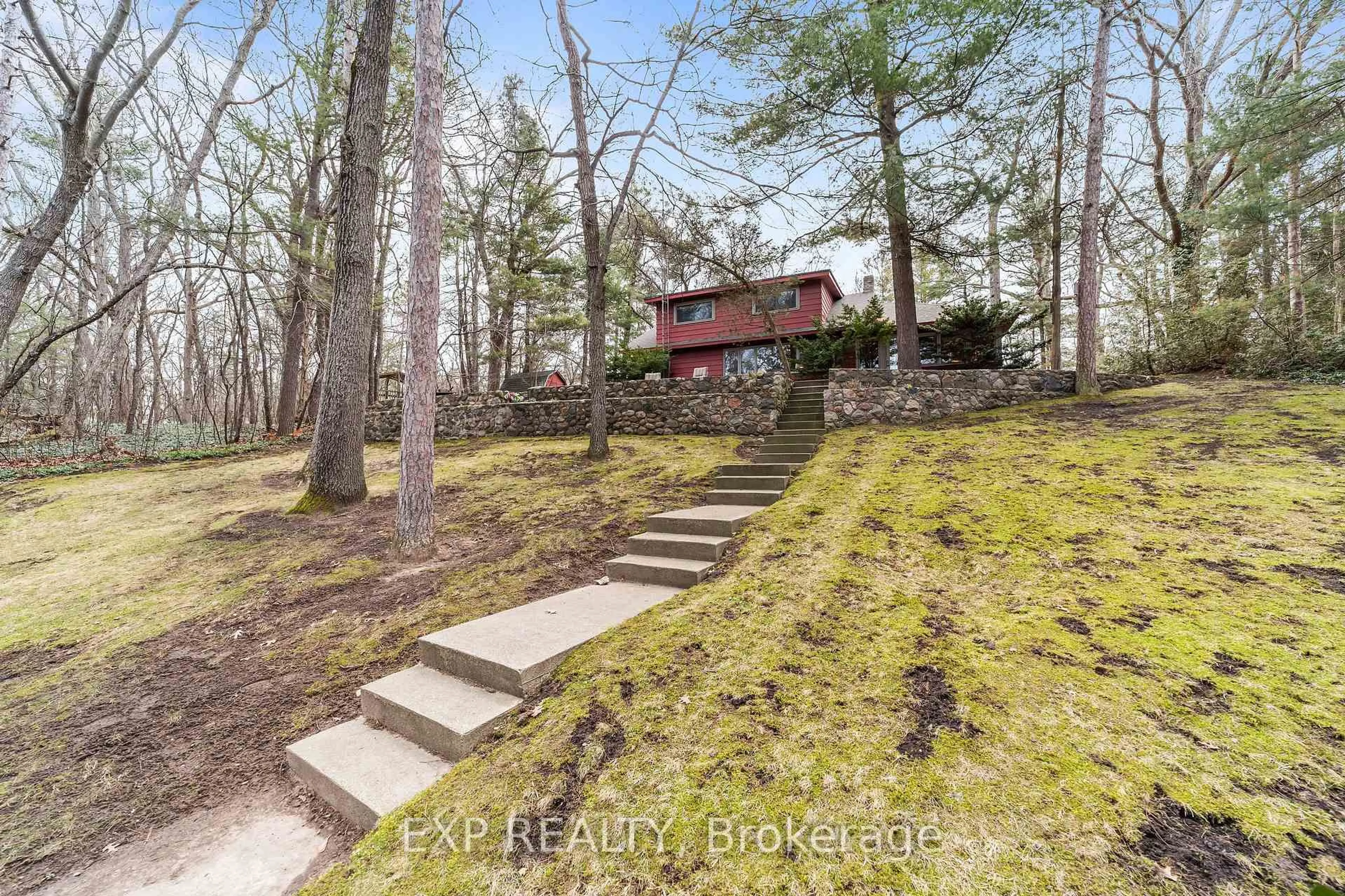 A pic from outside/outdoor area/front of a property/back of a property/a pic from drone, forest/trees view for 9 Summit Ave, South Huron Ontario N0M 1T0