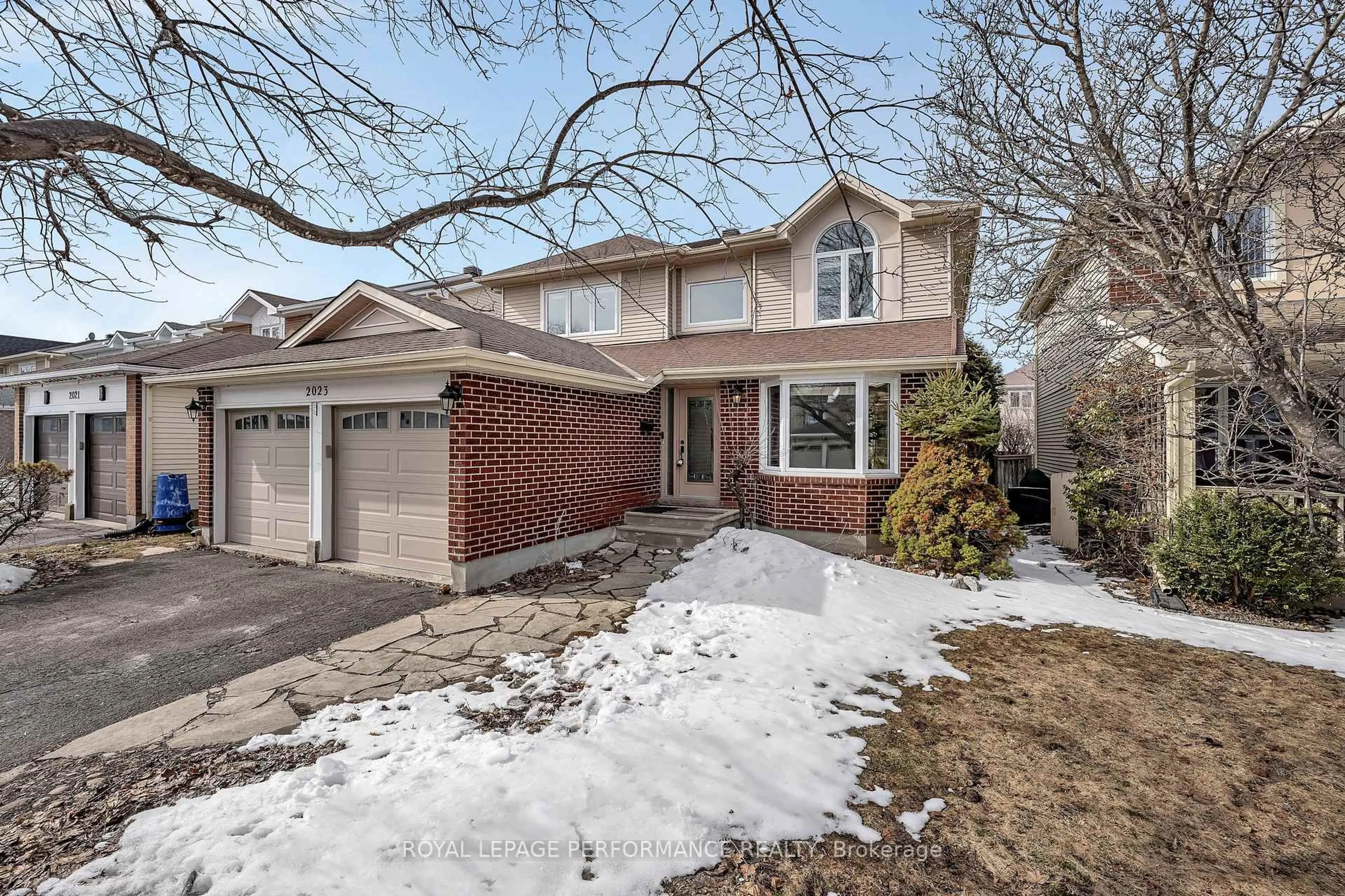 Home with brick exterior material, street for 2023 Rolling Brook Dr, Ottawa Ontario K1W 1C9