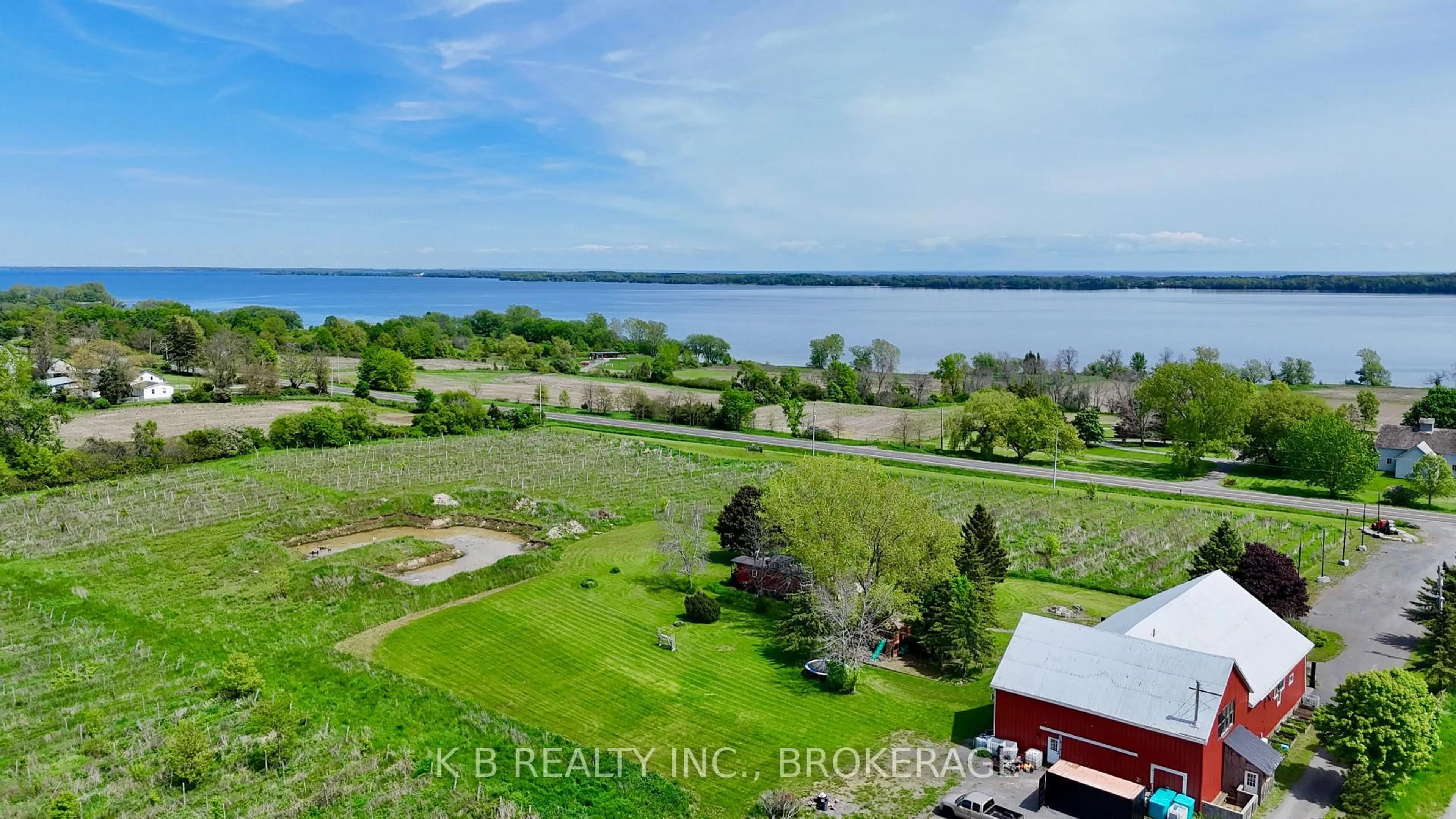 A pic from outside/outdoor area/front of a property/back of a property/a pic from drone, water/lake/river/ocean view for 9261 Loyalist Pkwy, Bath Ontario K0H 1G0