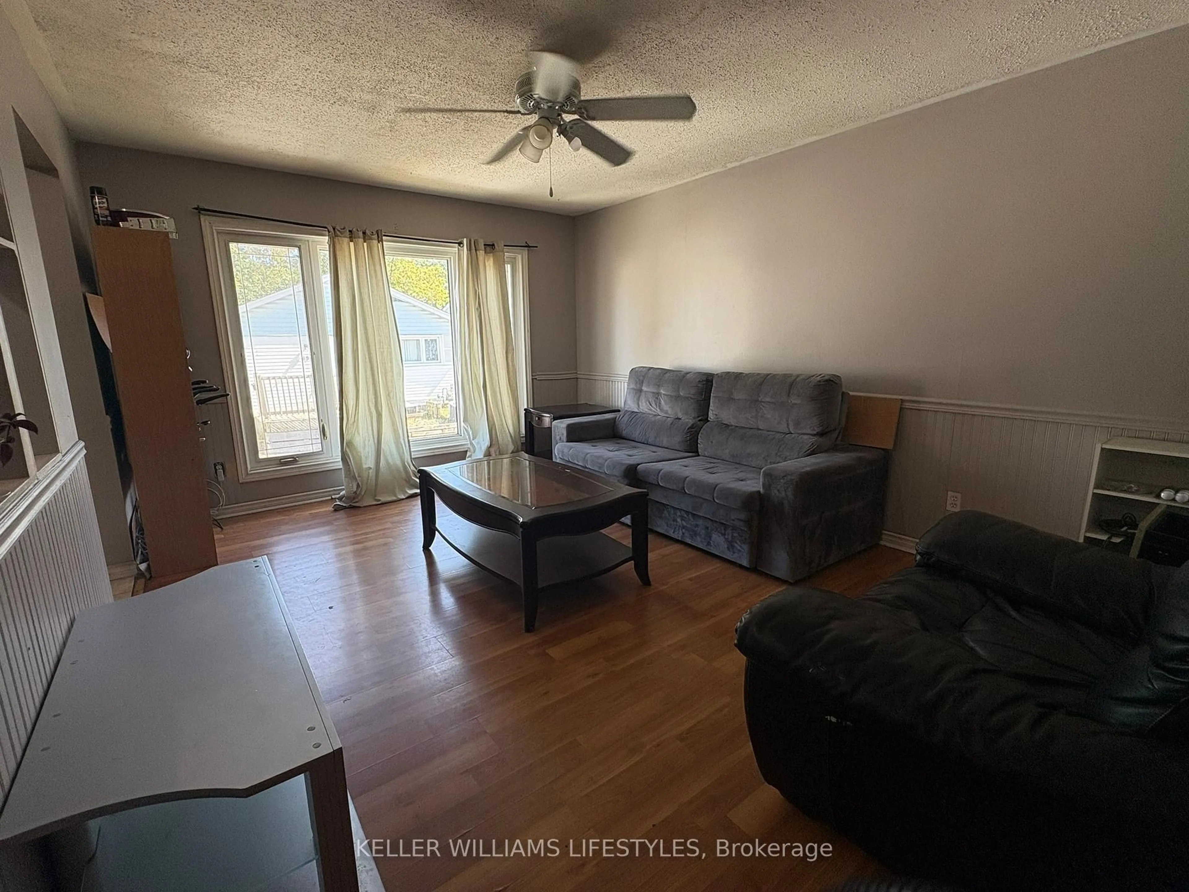 Living room with furniture, wood/laminate floor for 1840 Culver Dr, London East Ontario N5V 3K6