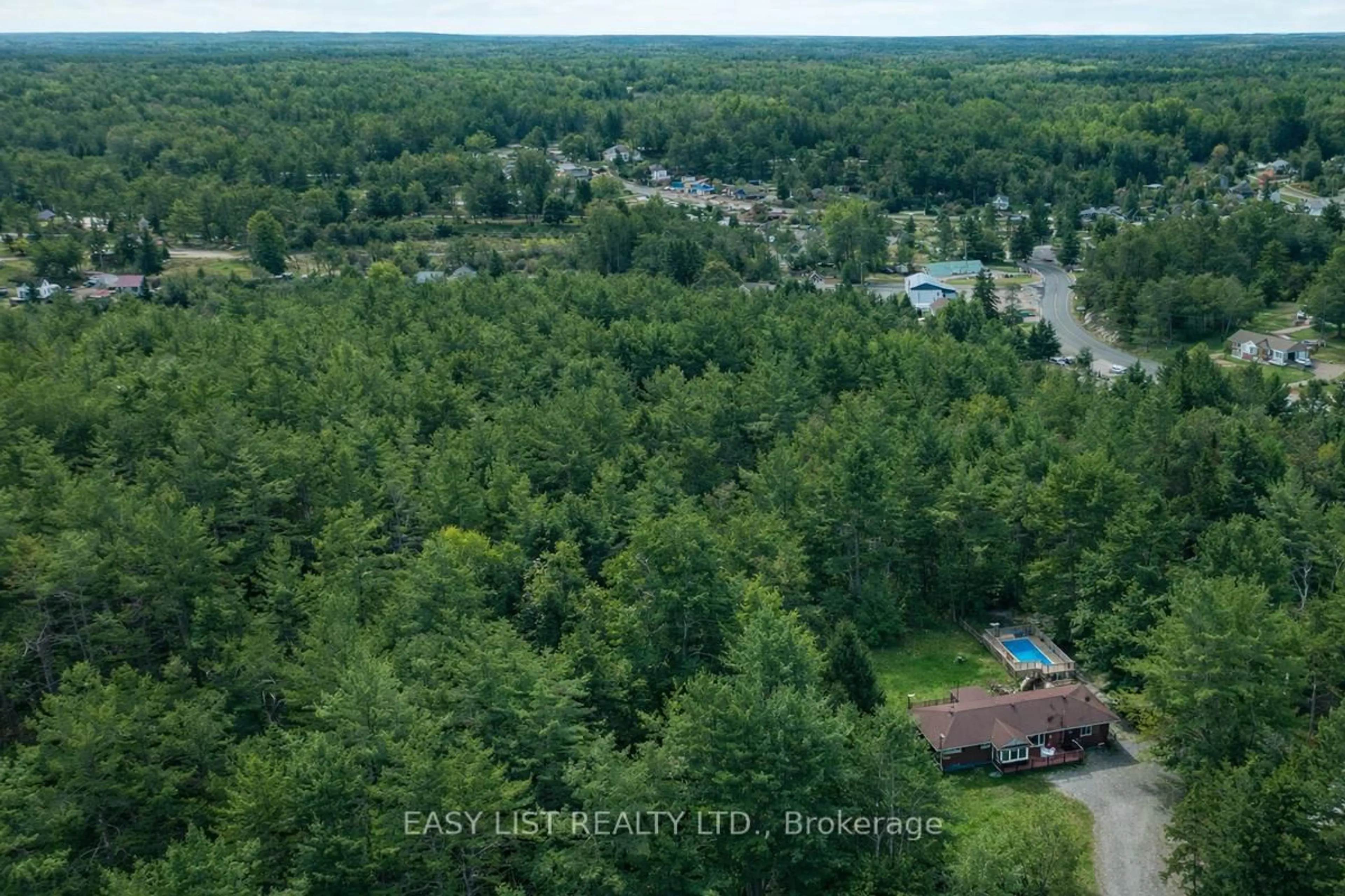 A pic from outside/outdoor area/front of a property/back of a property/a pic from drone, forest/trees view for 26 Reid Rd, Trent Lakes Ontario K0M 2A0