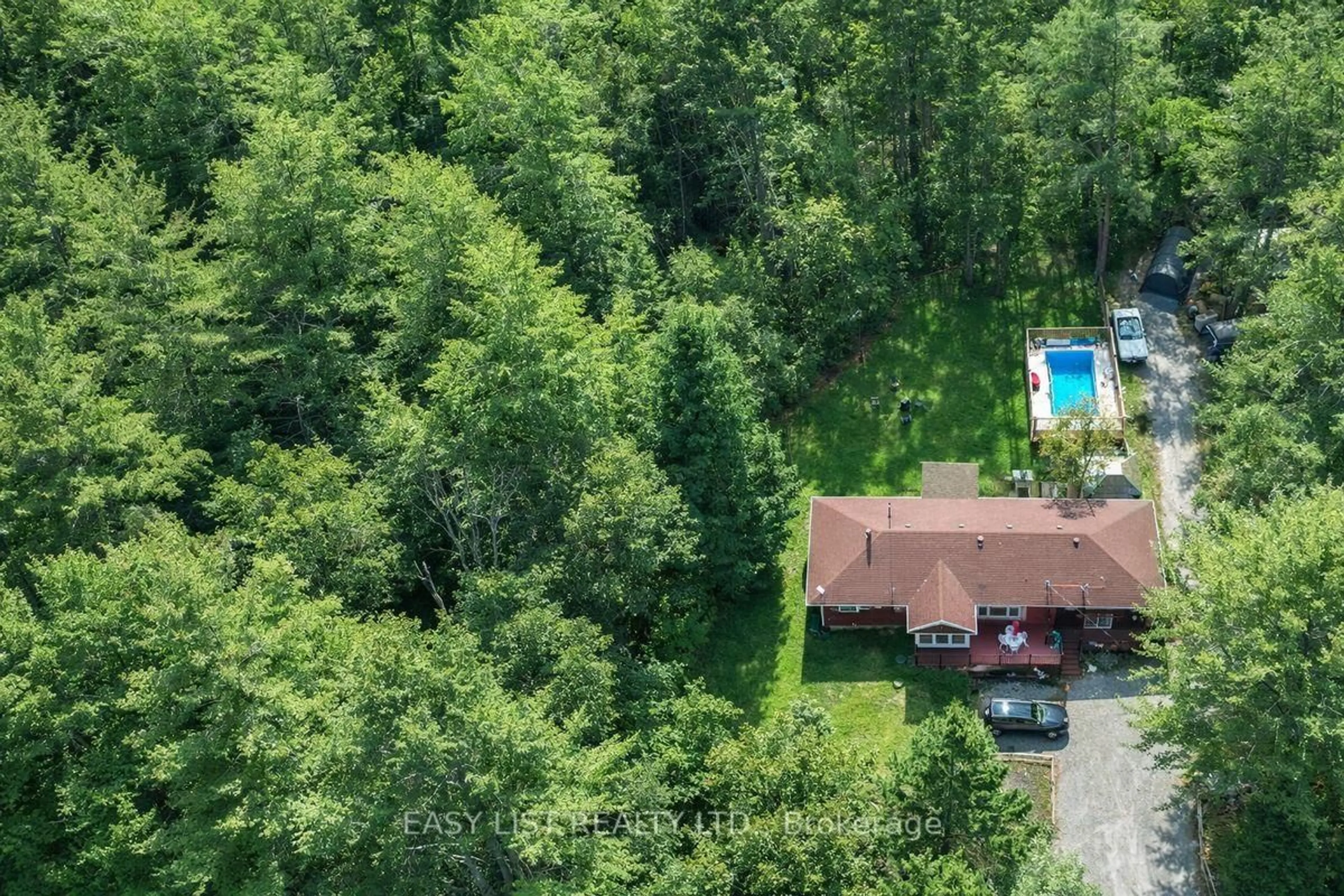 A pic from outside/outdoor area/front of a property/back of a property/a pic from drone, forest/trees view for 26 Reid Rd, Trent Lakes Ontario K0M 2A0