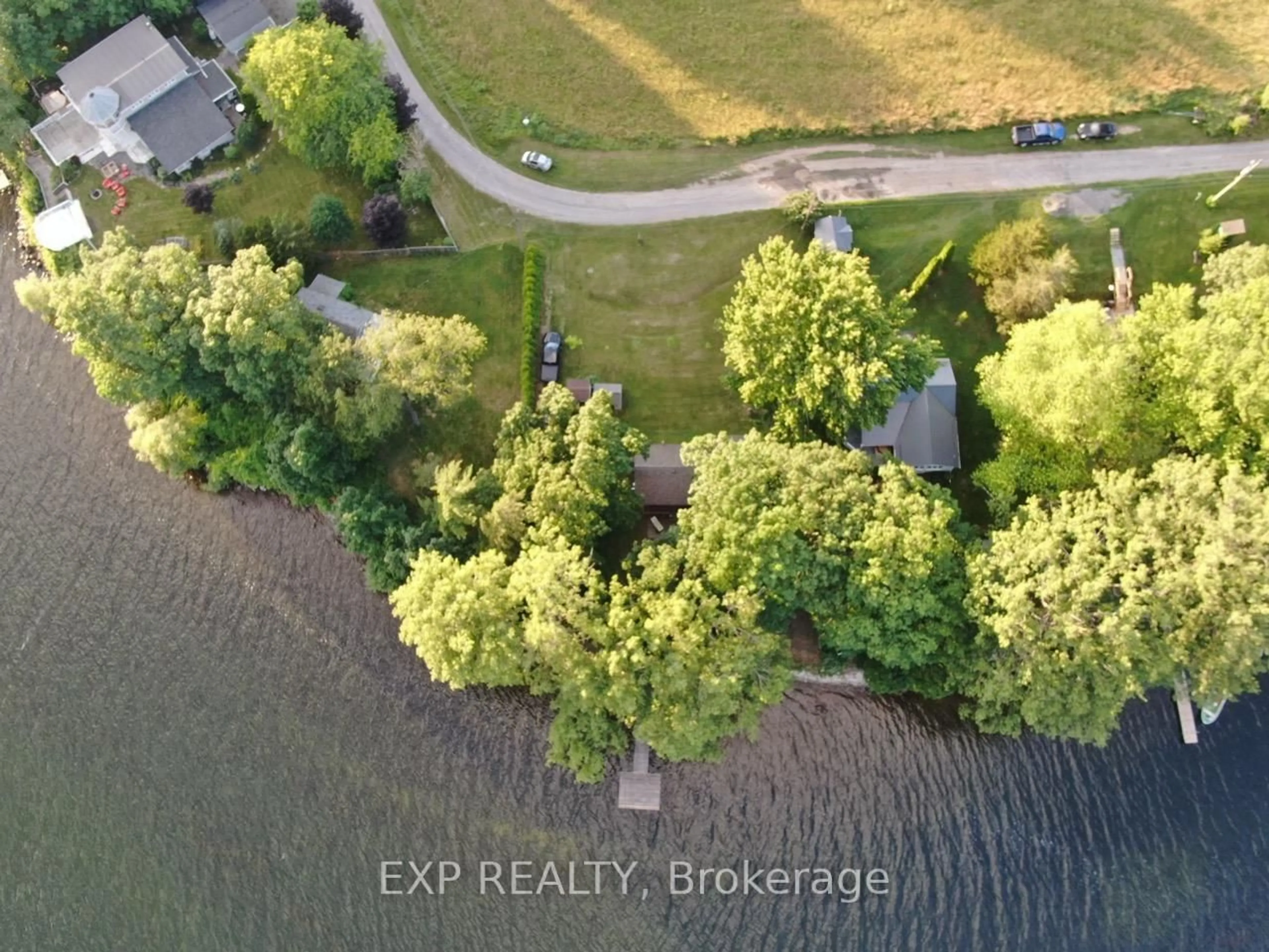 A pic from outside/outdoor area/front of a property/back of a property/a pic from drone, forest/trees view for 32 Quinte View Rd, Bath Ontario K0H 1G0