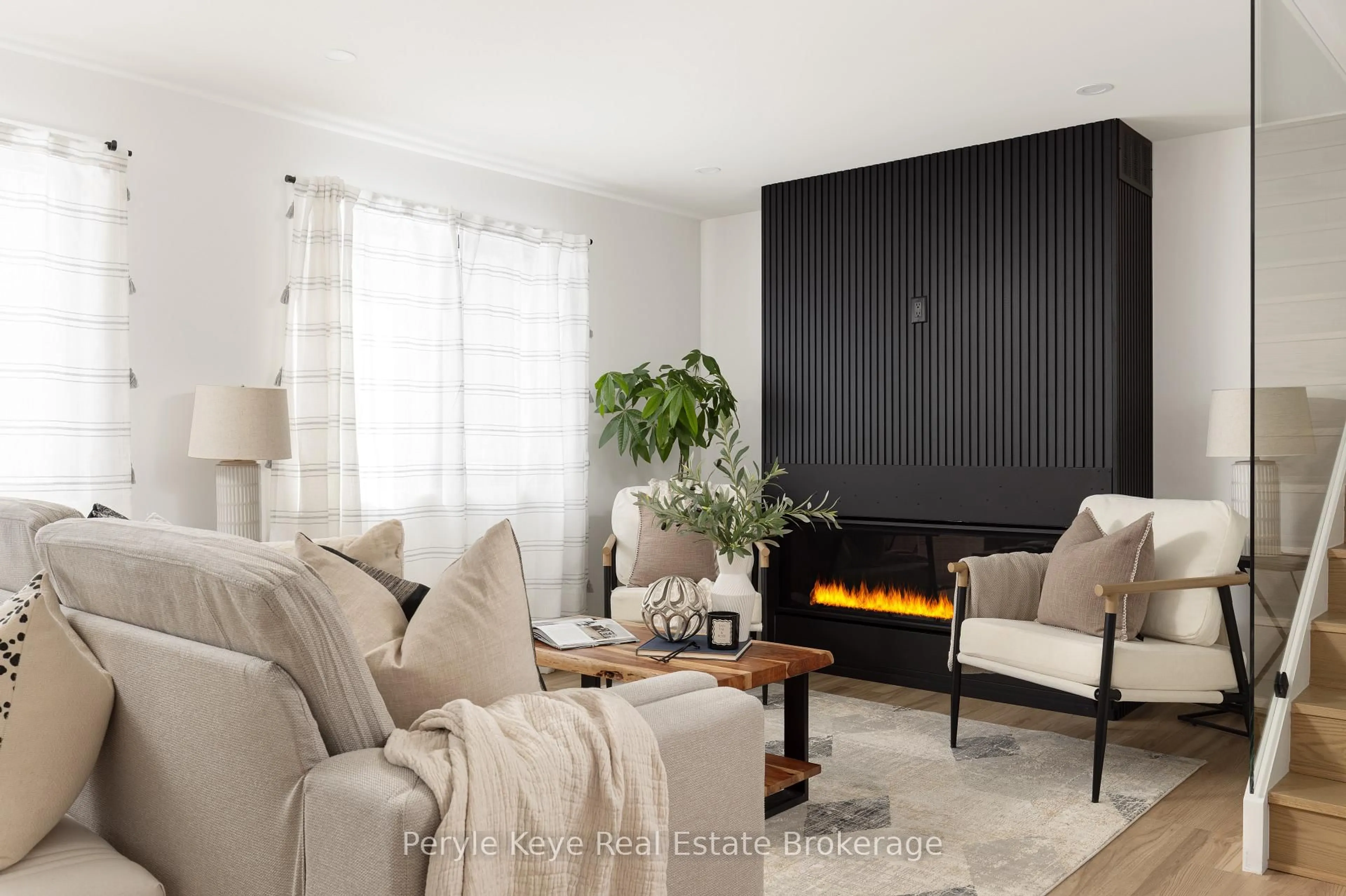 Living room with furniture, wood/laminate floor for 1290 Cedar Lane, Bracebridge Ontario P1L 1W9