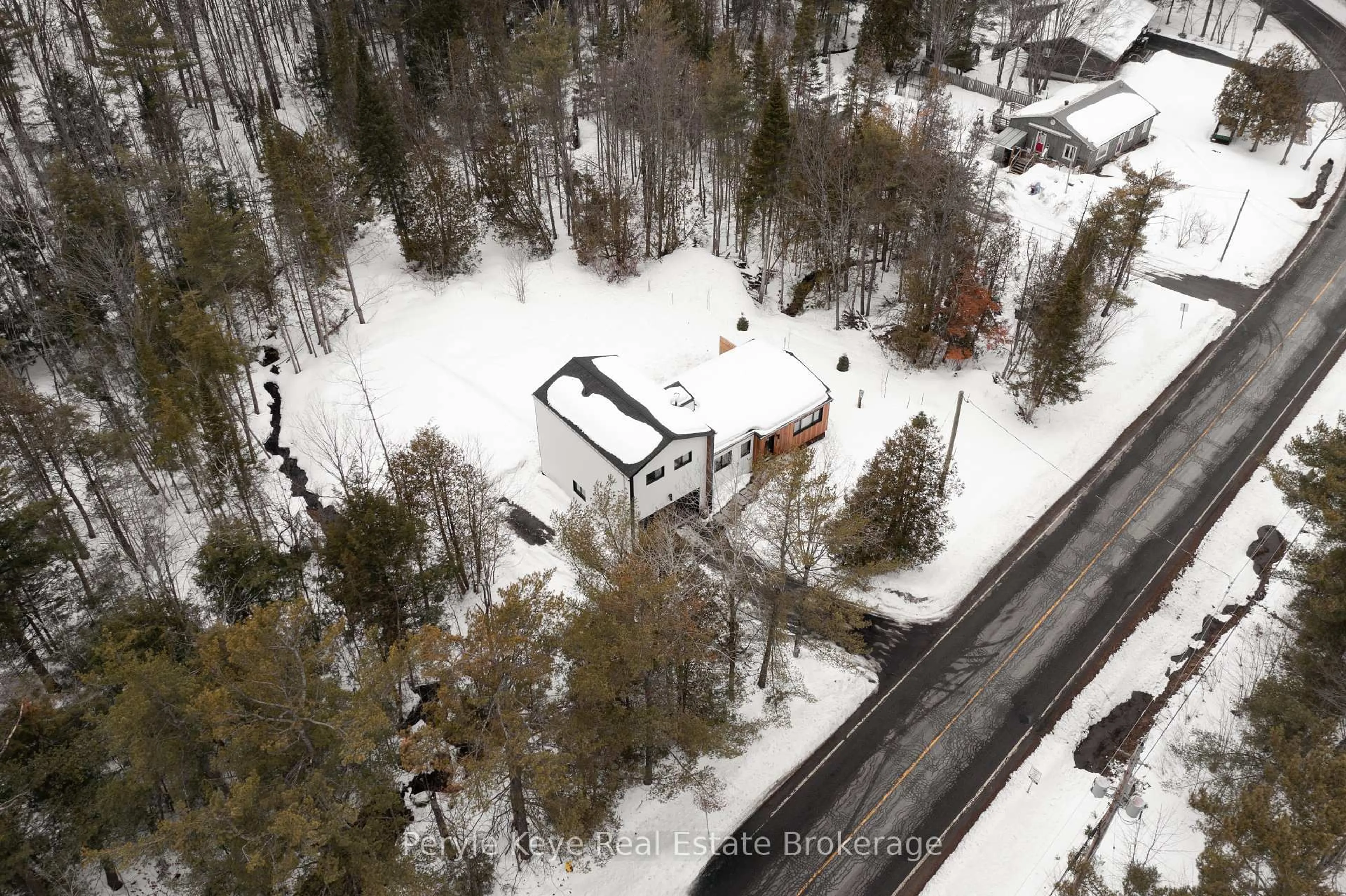 A pic from outside/outdoor area/front of a property/back of a property/a pic from drone, street for 1290 Cedar Lane, Bracebridge Ontario P1L 1W9