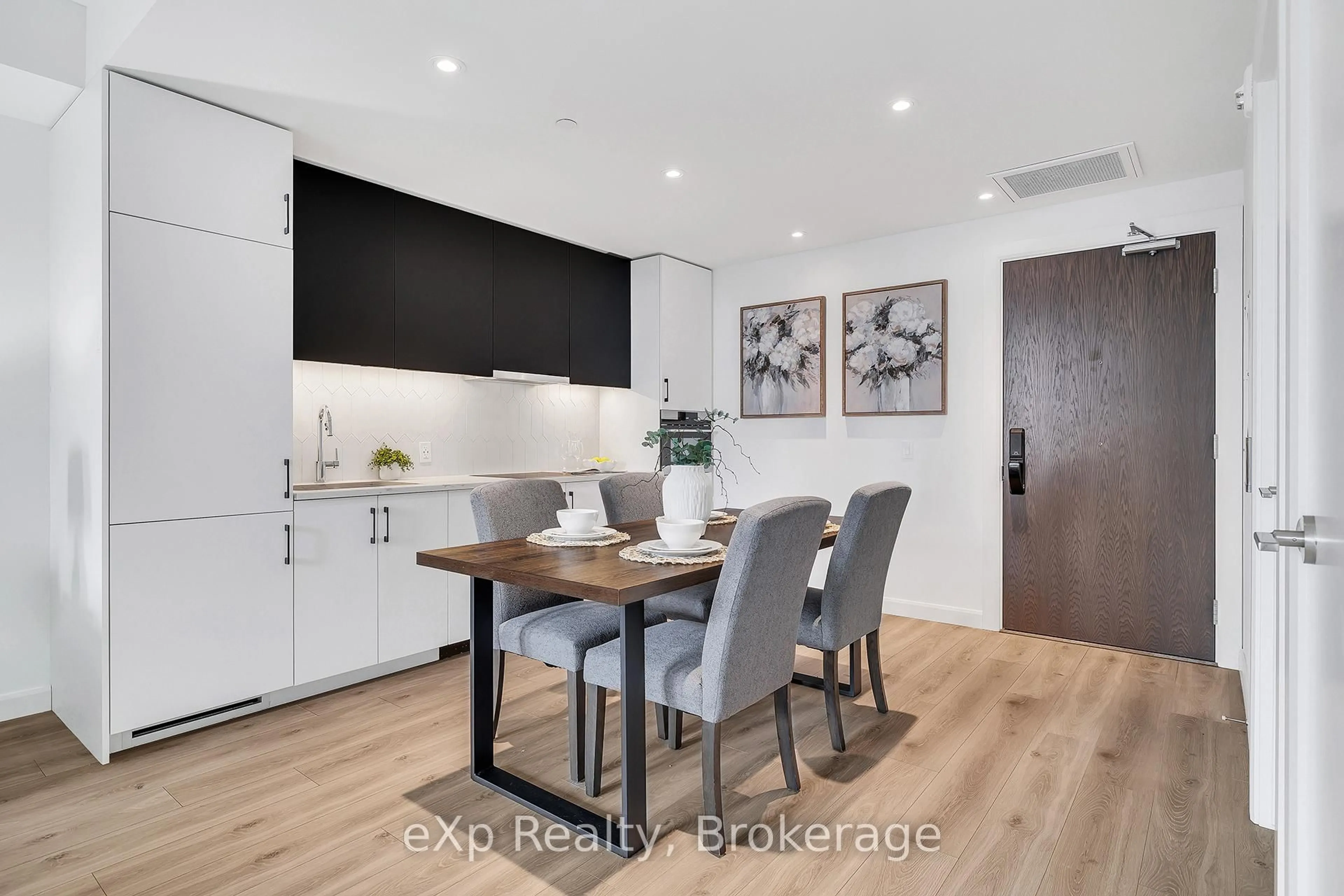 Open concept kitchen, wood/laminate floor for 741 King St #306, Kitchener Ontario N2G 0E9