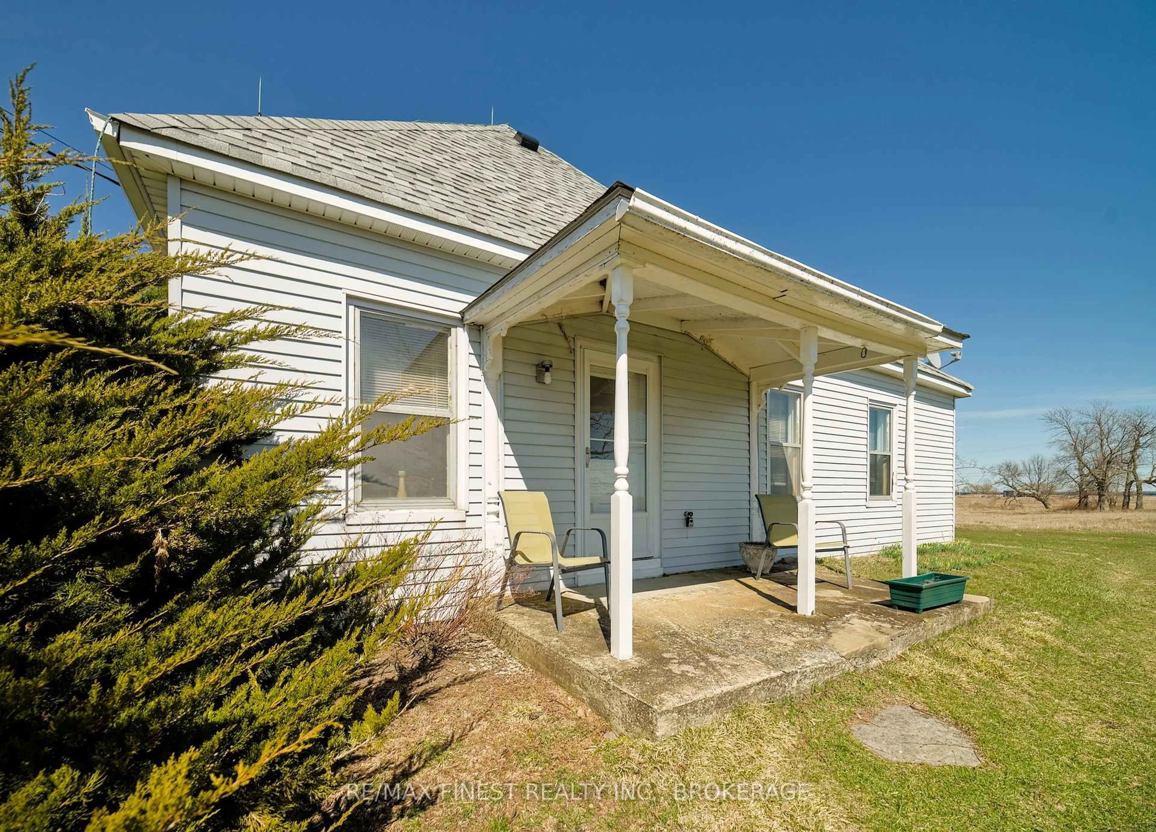 Home with vinyl exterior material, street for 10 Front Rd, Stella Ontario K0H 2S0