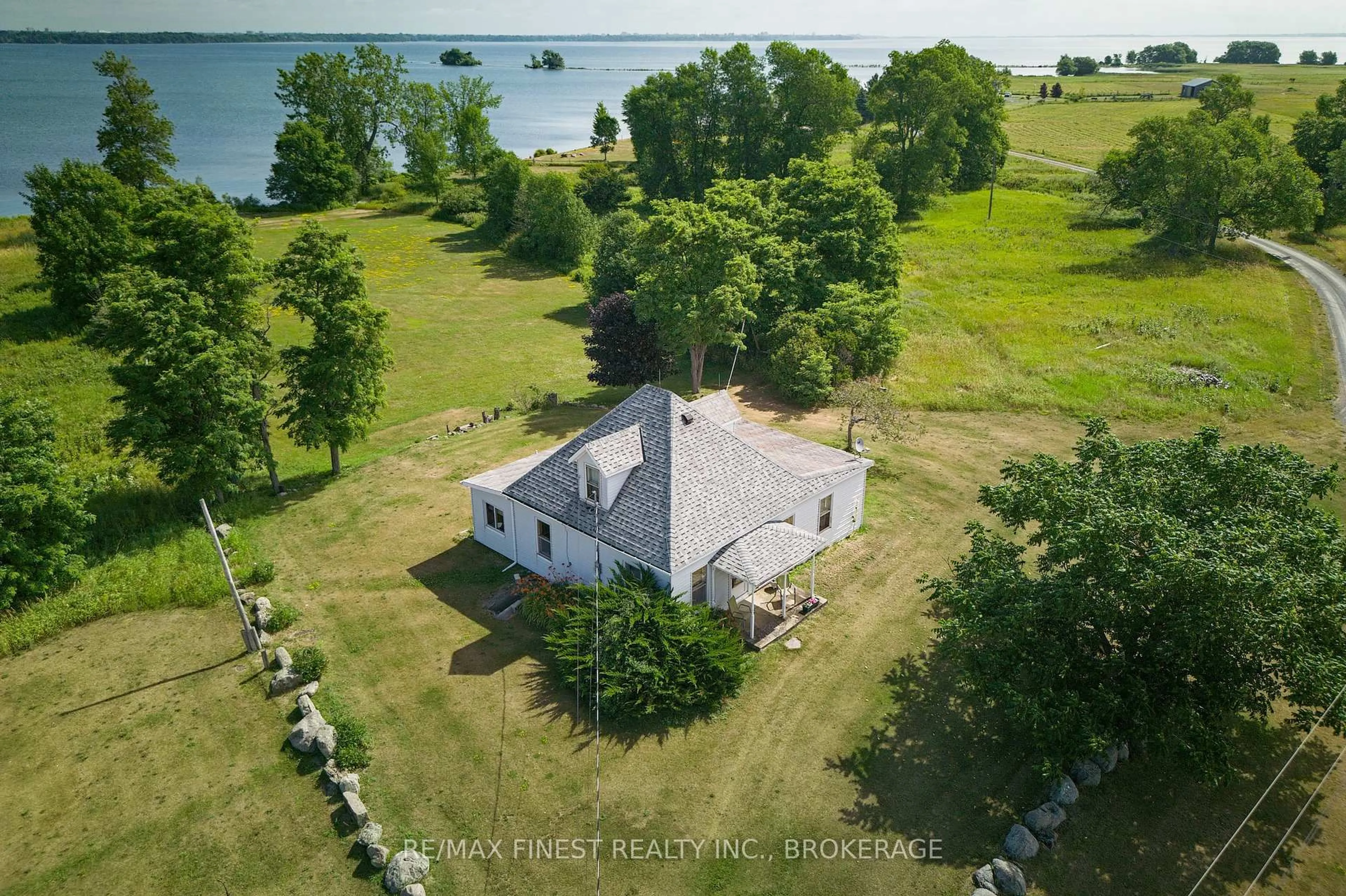 A pic from outside/outdoor area/front of a property/back of a property/a pic from drone, water/lake/river/ocean view for 10 Front Rd, Stella Ontario K0H 2S0