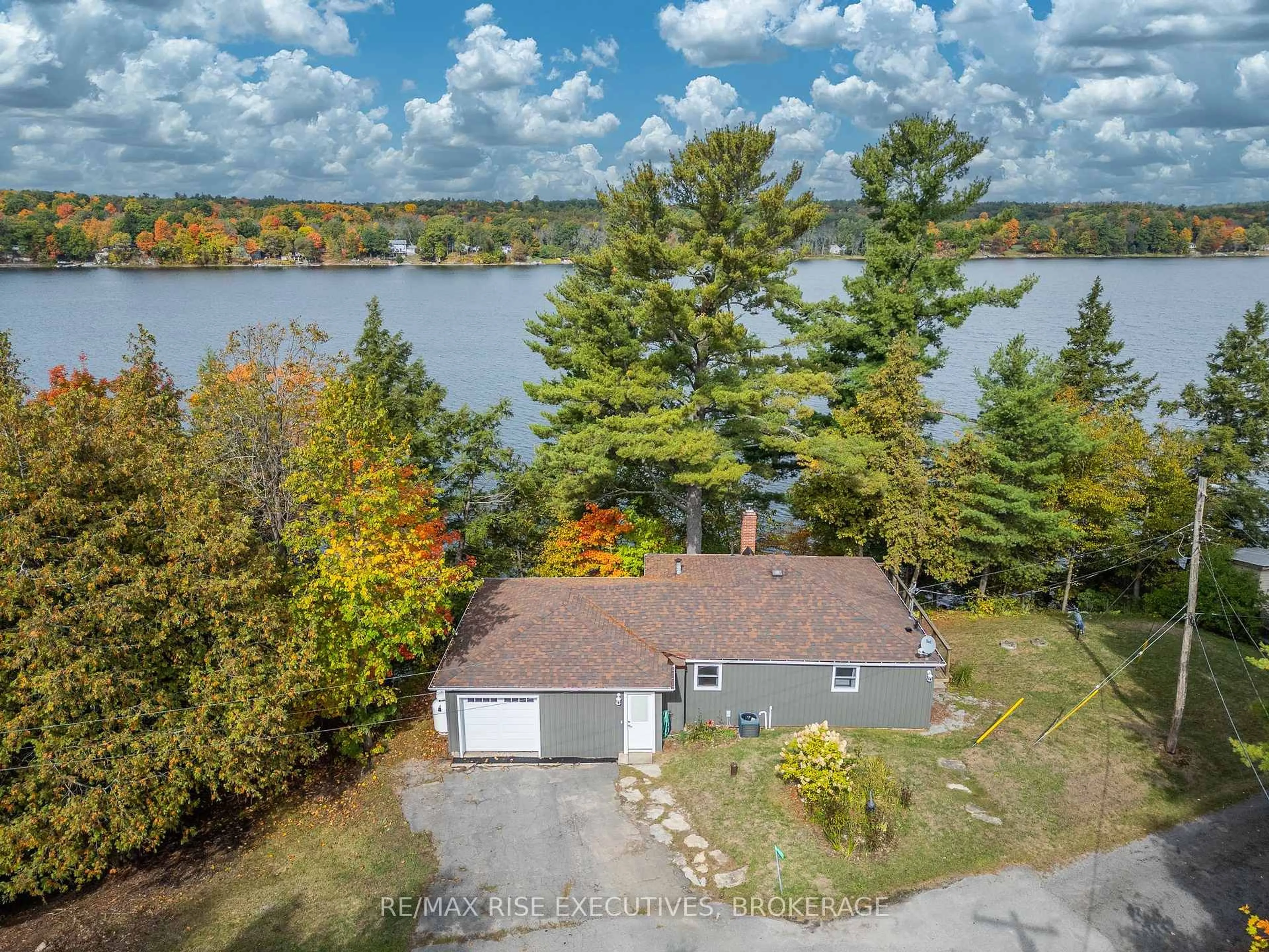 A pic from outside/outdoor area/front of a property/back of a property/a pic from drone, water/lake/river/ocean view for 1017 Woods Lane, Hartington Ontario K0H 1W0