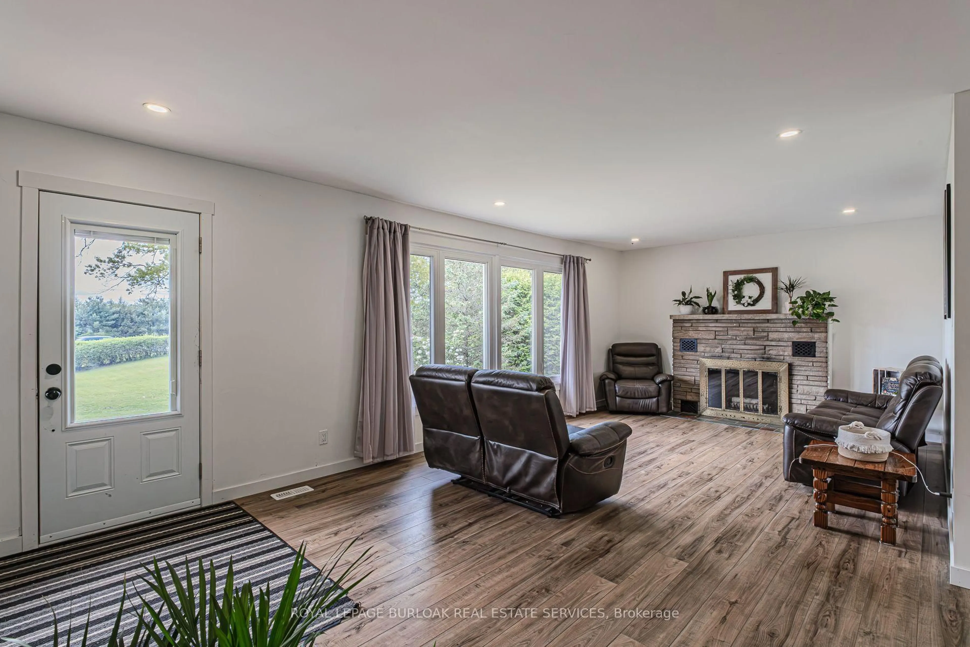 Living room with furniture, wood/laminate floor for 2364 Windham West Quarterline Rd, Norfolk Ontario N3Y 4J9