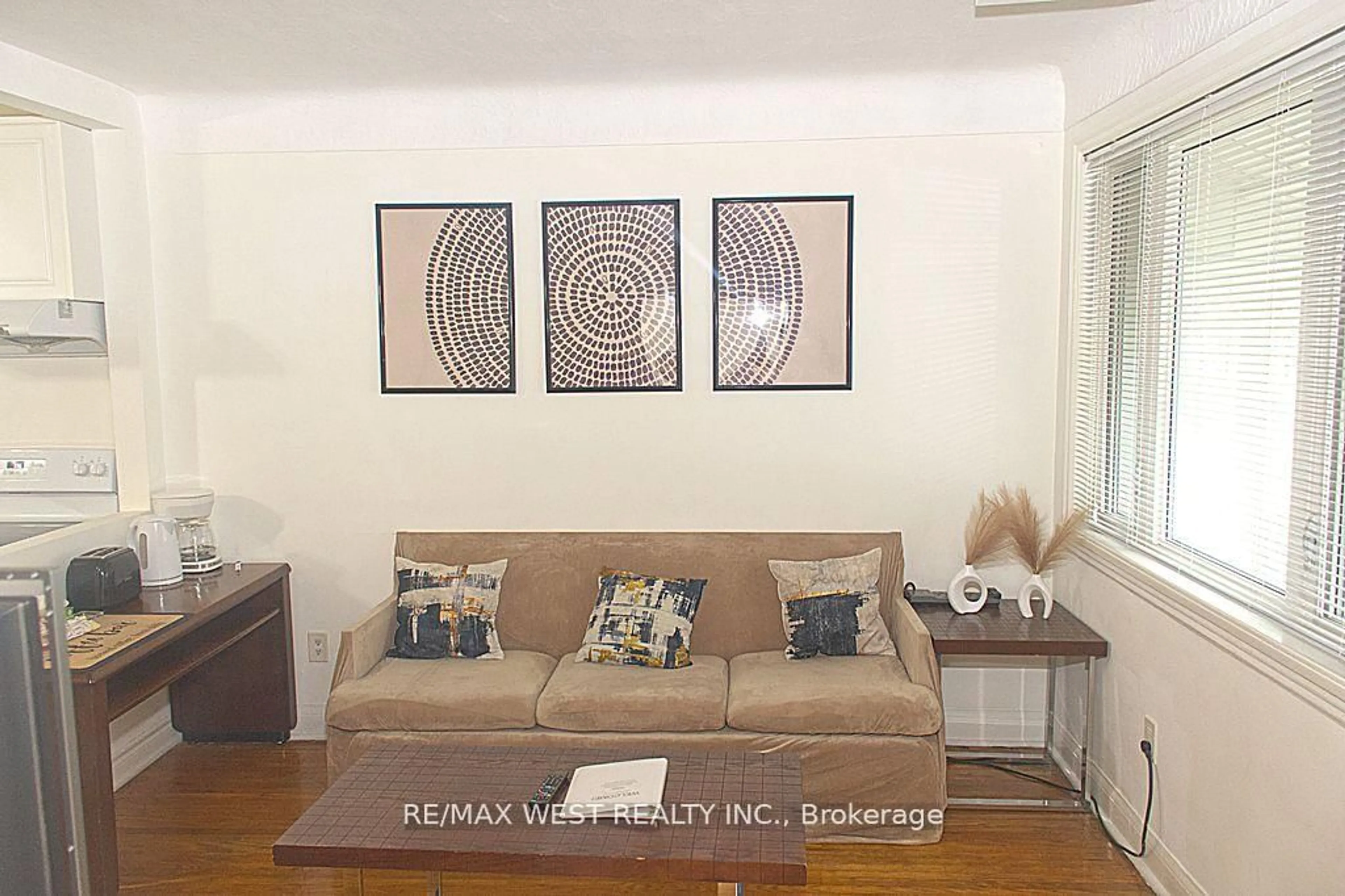 Living room with furniture, wood/laminate floor for 5177 Kitchener St, Niagara Falls Ontario L2G 1B4