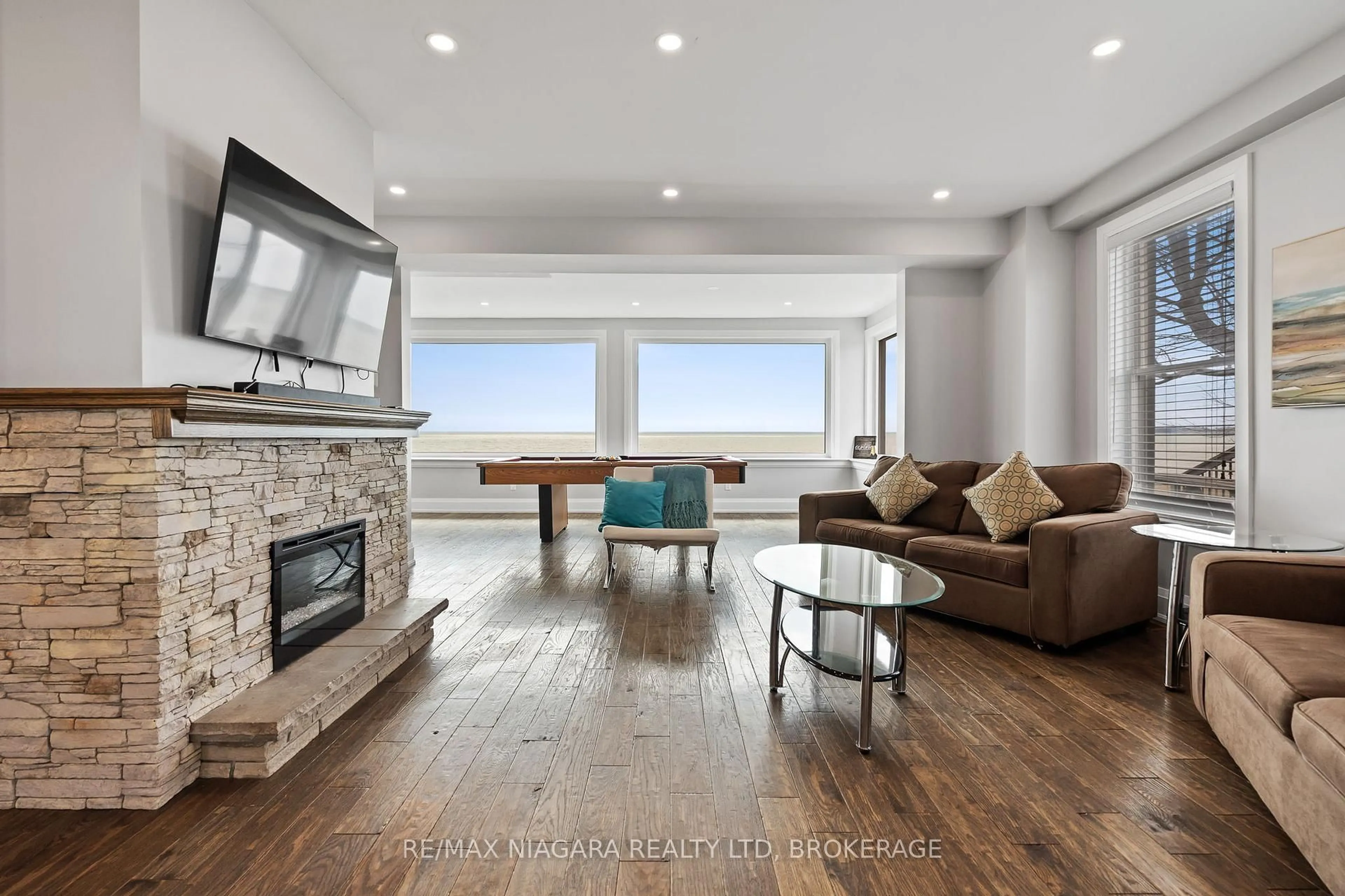 Living room with furniture, wood/laminate floor for 2952 North Shore (Regional Rd 3) Dr, Haldimand Ontario N0A 1K0