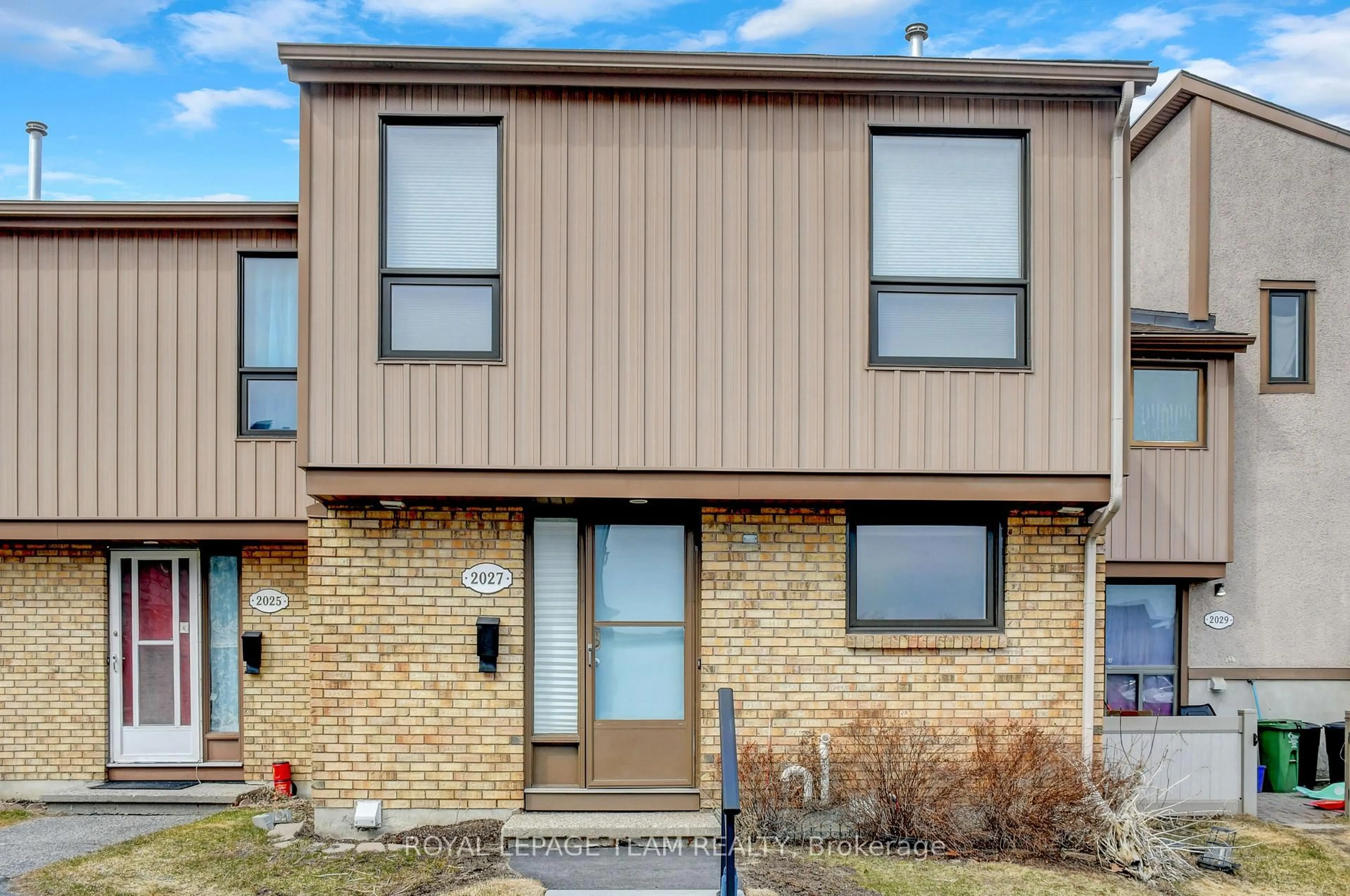 Home with brick exterior material, street for 2027 Stonehenge Cres #35, Ottawa Ontario K1B 4N7