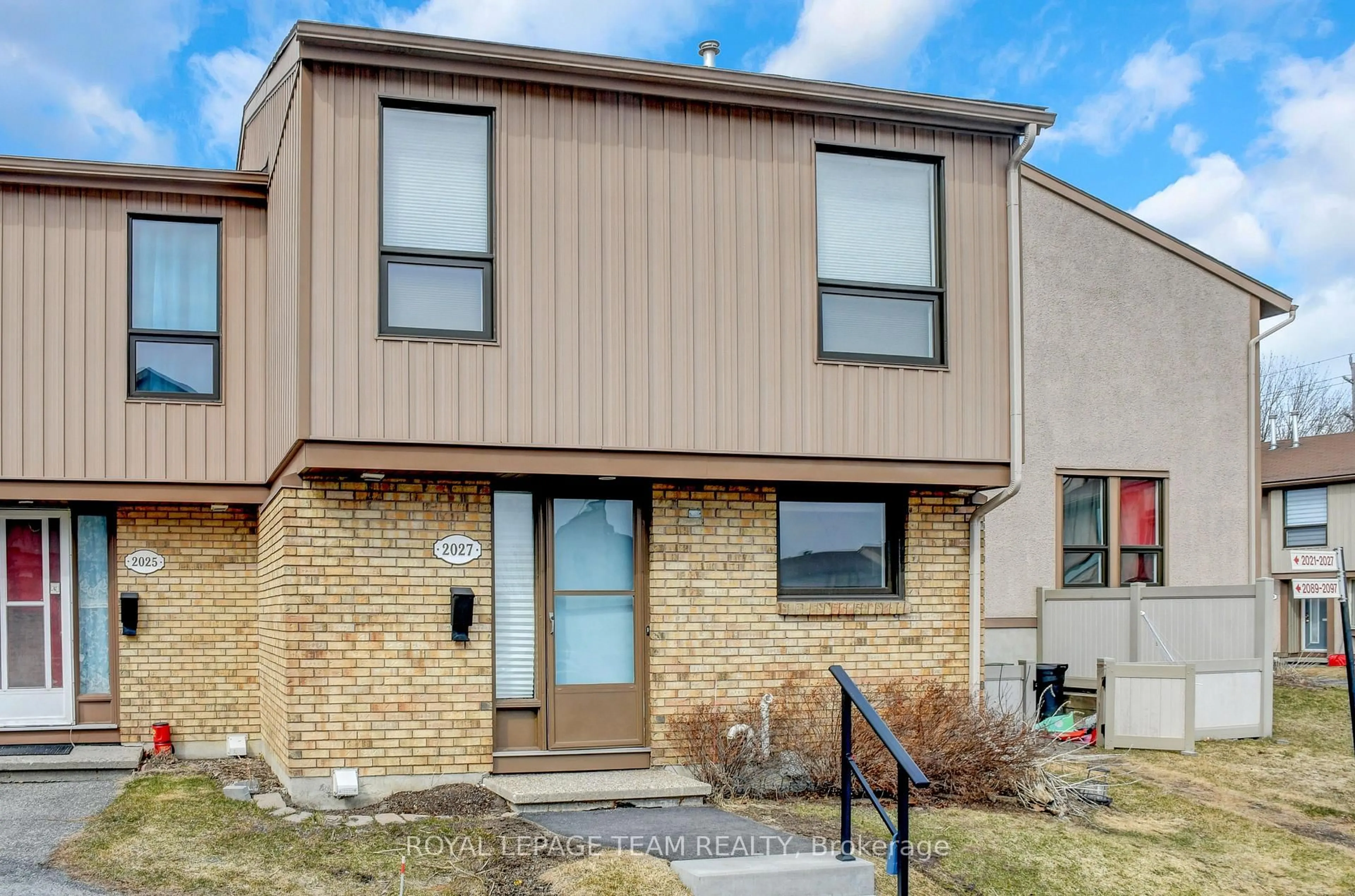 Home with brick exterior material, street for 2027 Stonehenge Cres #35, Ottawa Ontario K1B 4N7