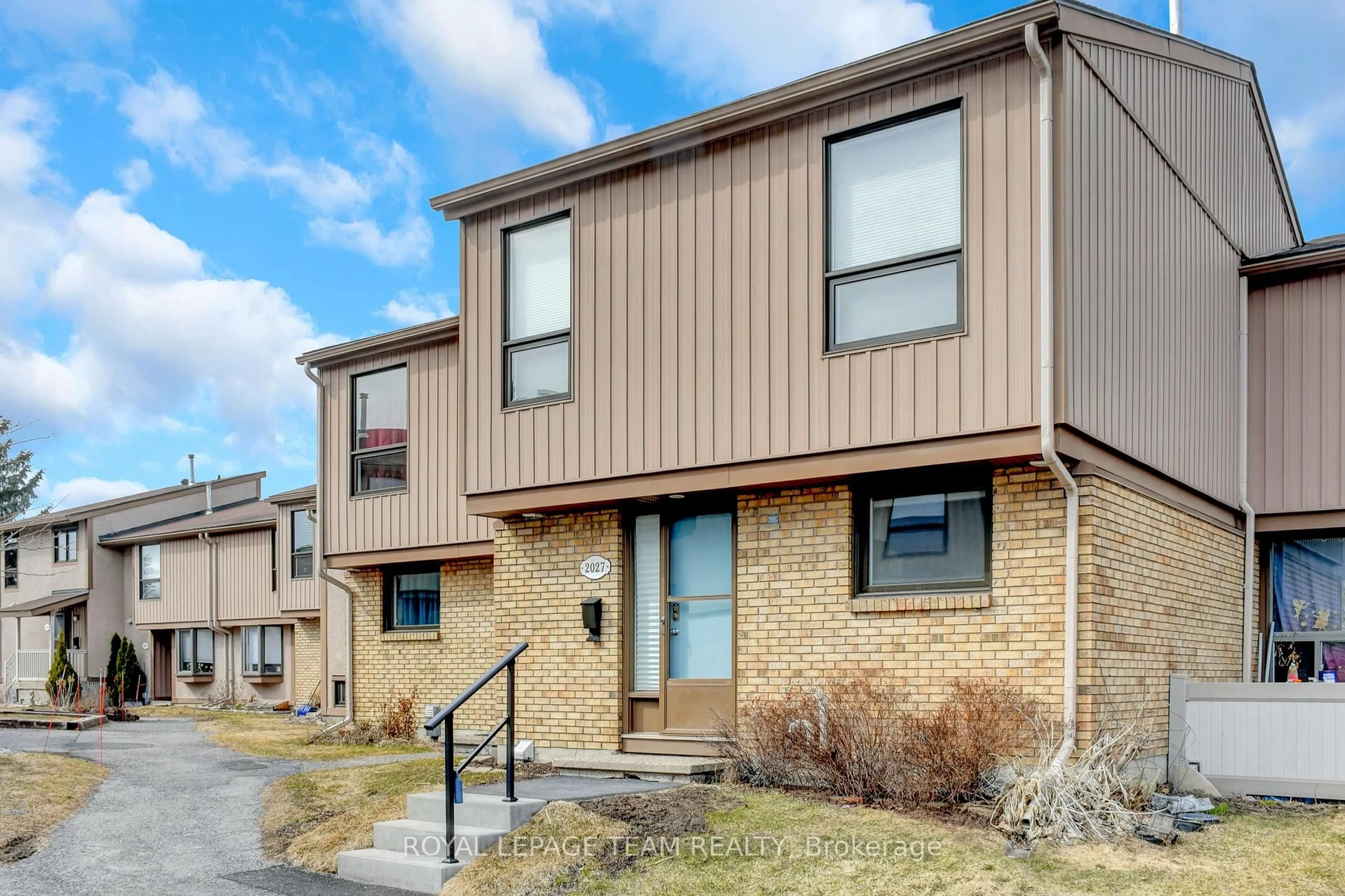 Home with brick exterior material, street for 2027 Stonehenge Cres #35, Ottawa Ontario K1B 4N7