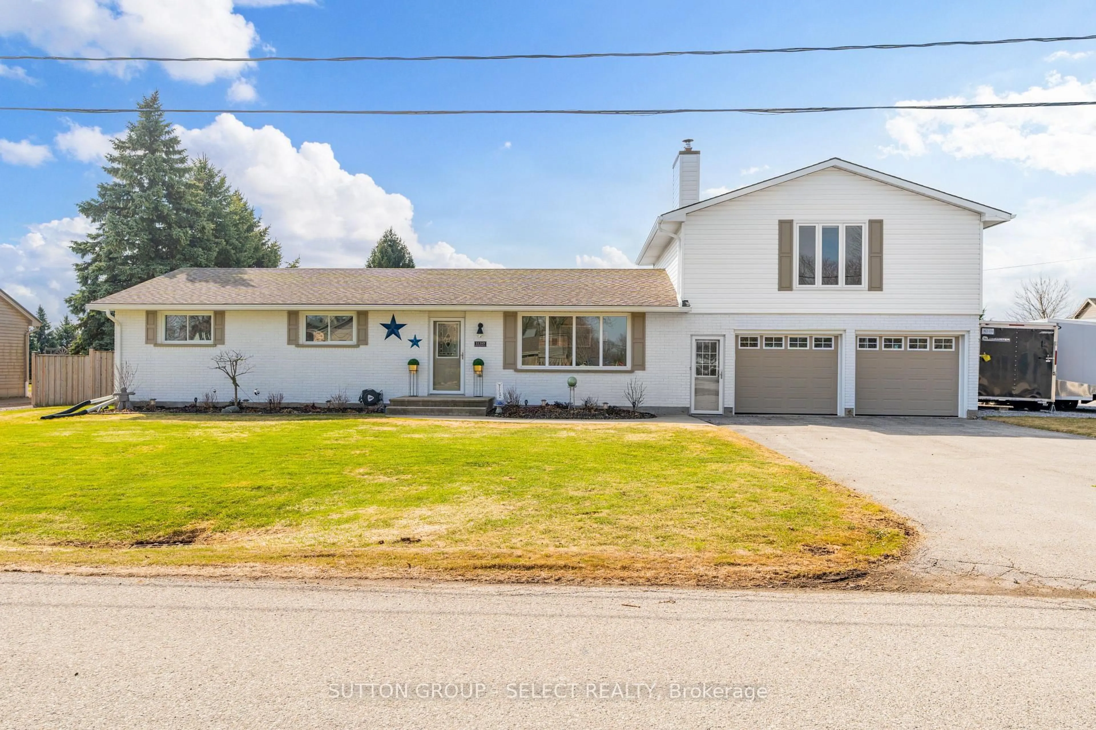 Home with vinyl exterior material, street for 51169 Clinton St, Malahide Ontario N0L 2J0