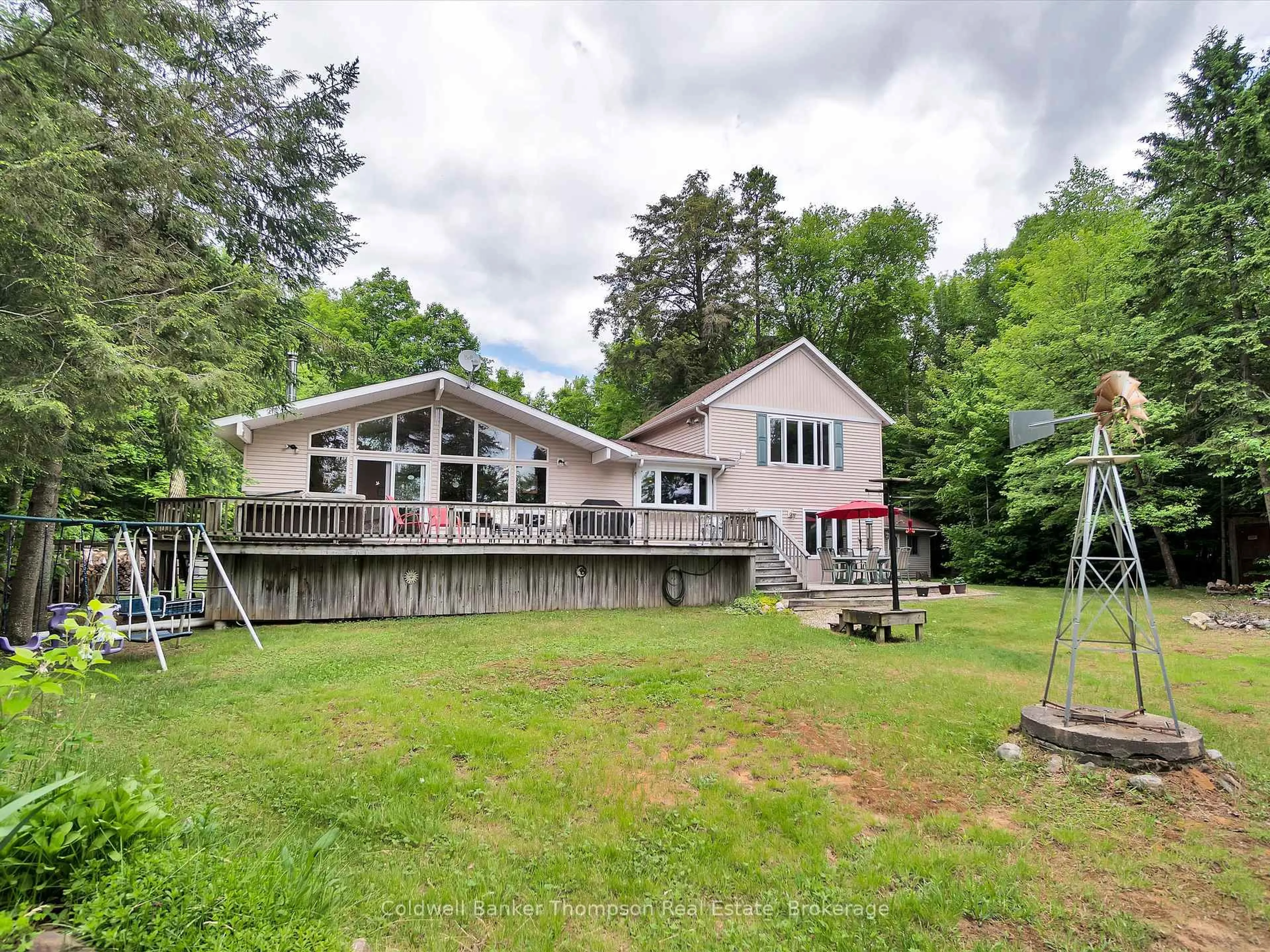 A pic from outside/outdoor area/front of a property/back of a property/a pic from drone, water/lake/river/ocean view for 1070 Grass Lake Rd, Kearney Ontario P0A 1M0